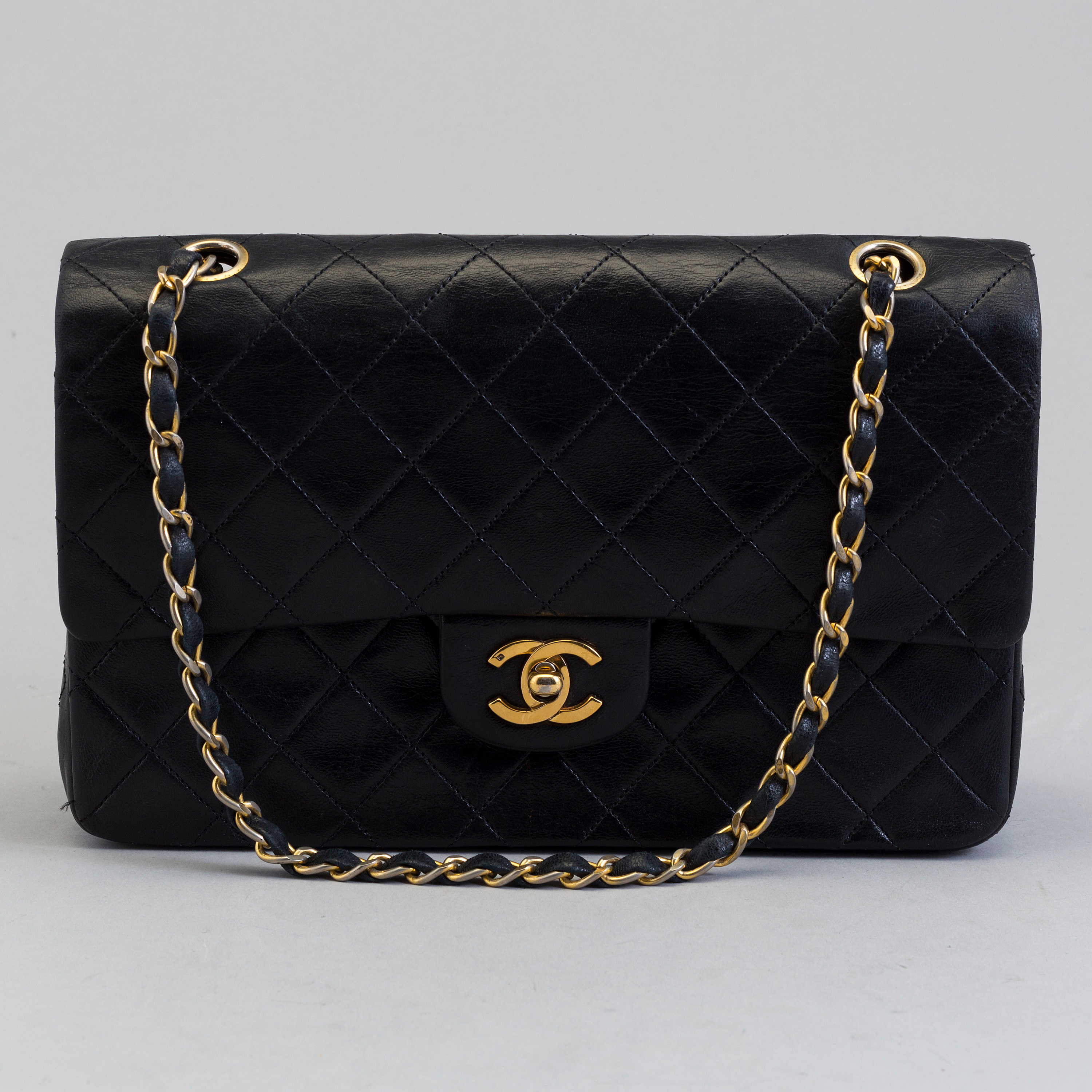CHANEL, a black leather shoulder bag, CHANEL, a black leather shoulder bag,