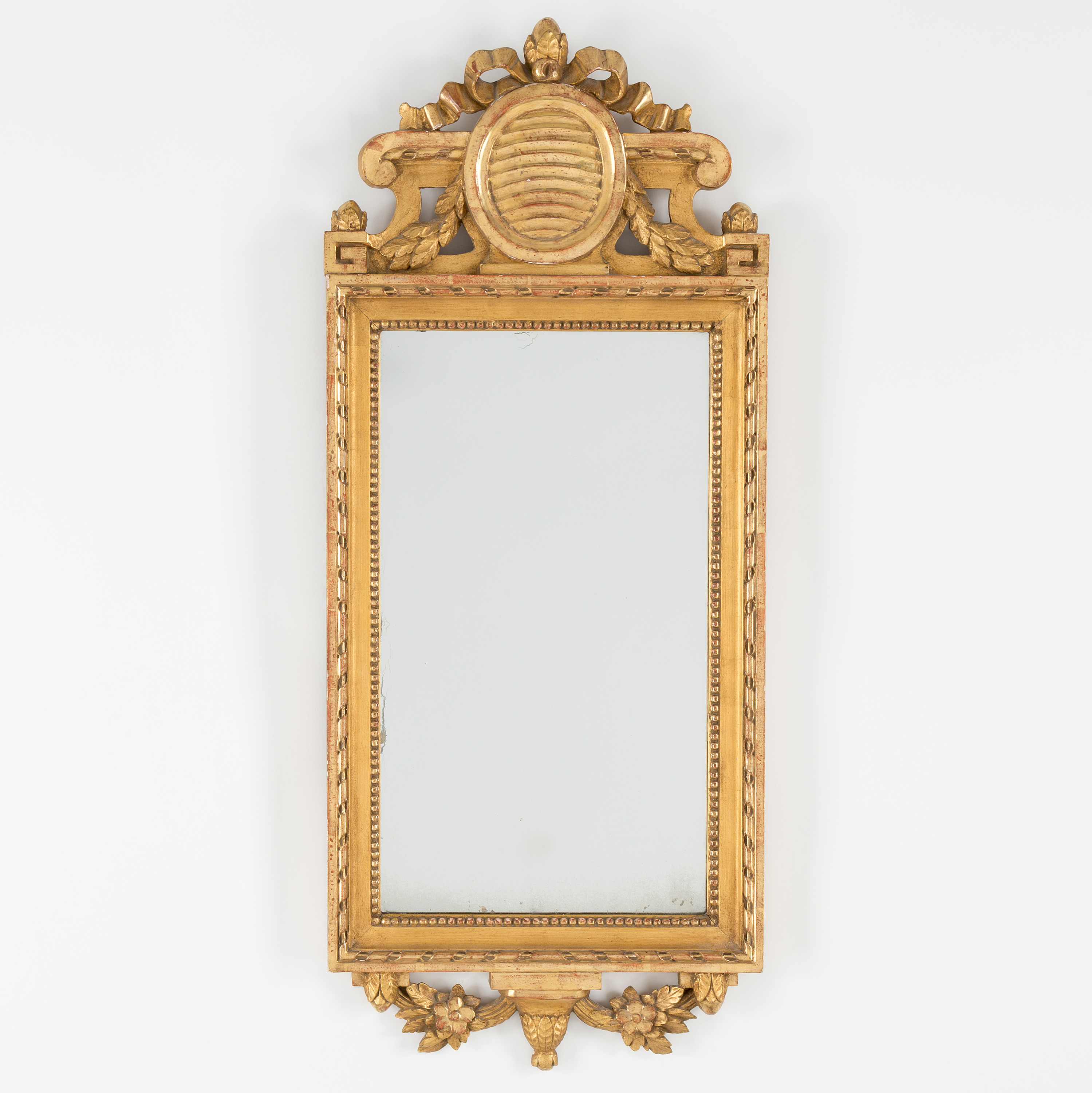 A gilt Gustavian style mirror, first half of the 20th Century. Bukowskis