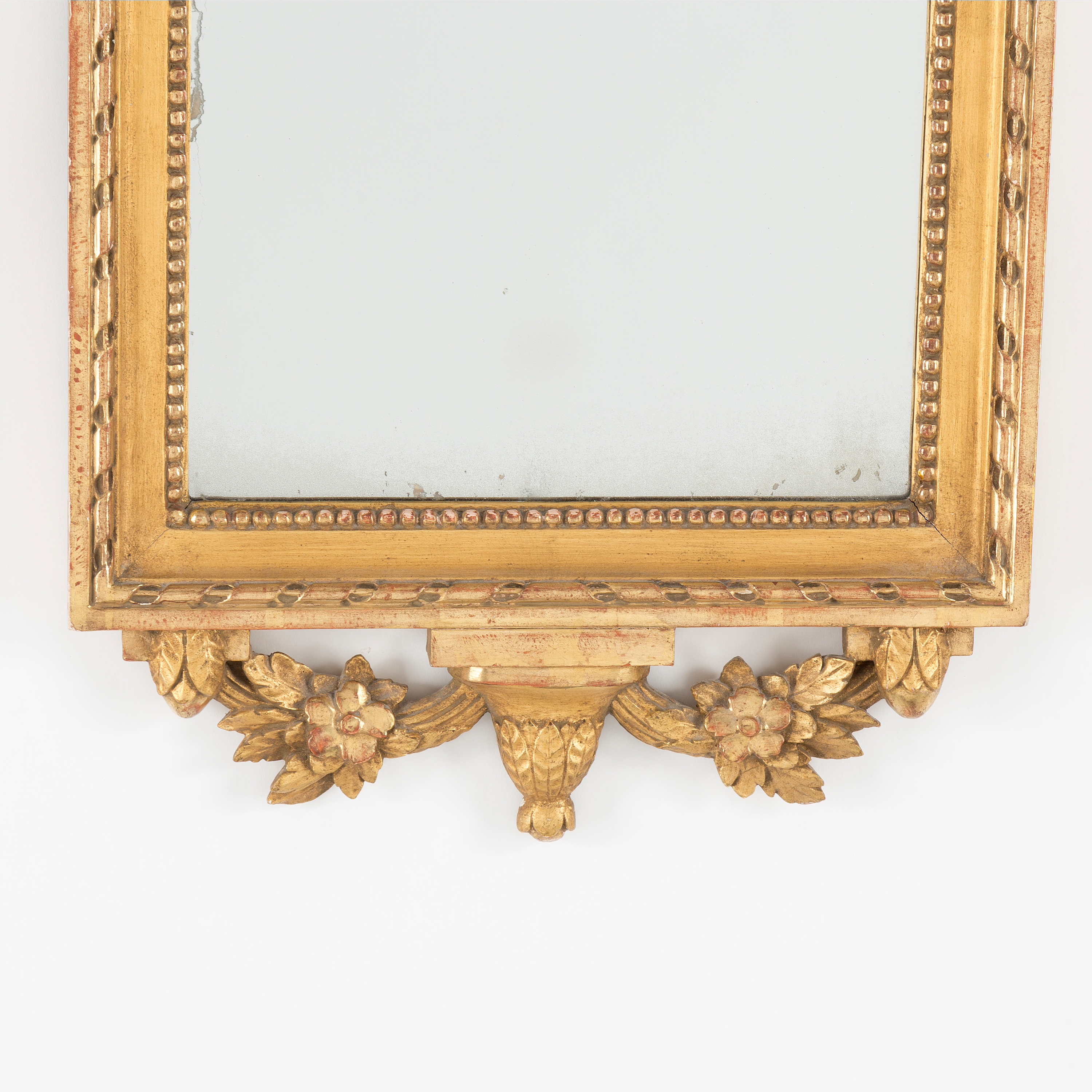 A gilt Gustavian style mirror, first half of the 20th Century. Bukowskis