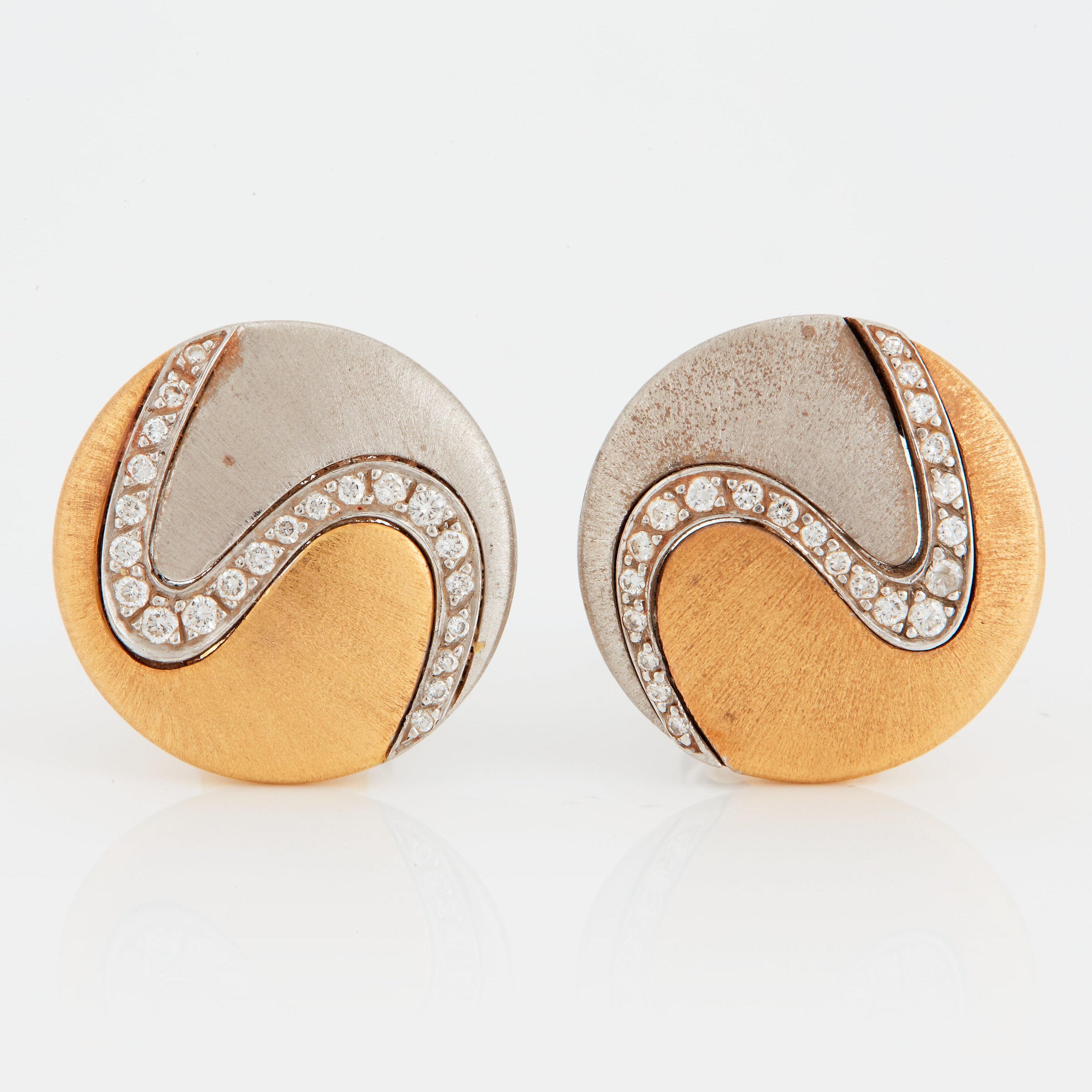 A pair of Paul Binder earrings in 18K gold and white gold set with round brilliantcut diamonds