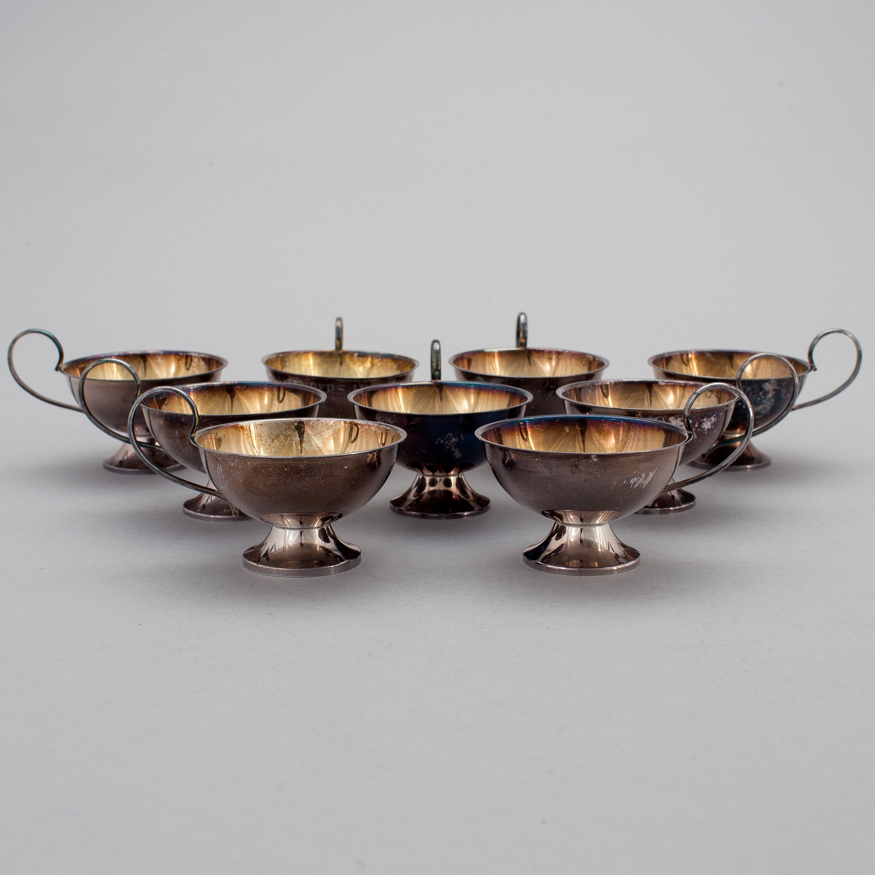 A Swedish set of nine silver punch cups Gothenburg 1946, 1969 and 1974
