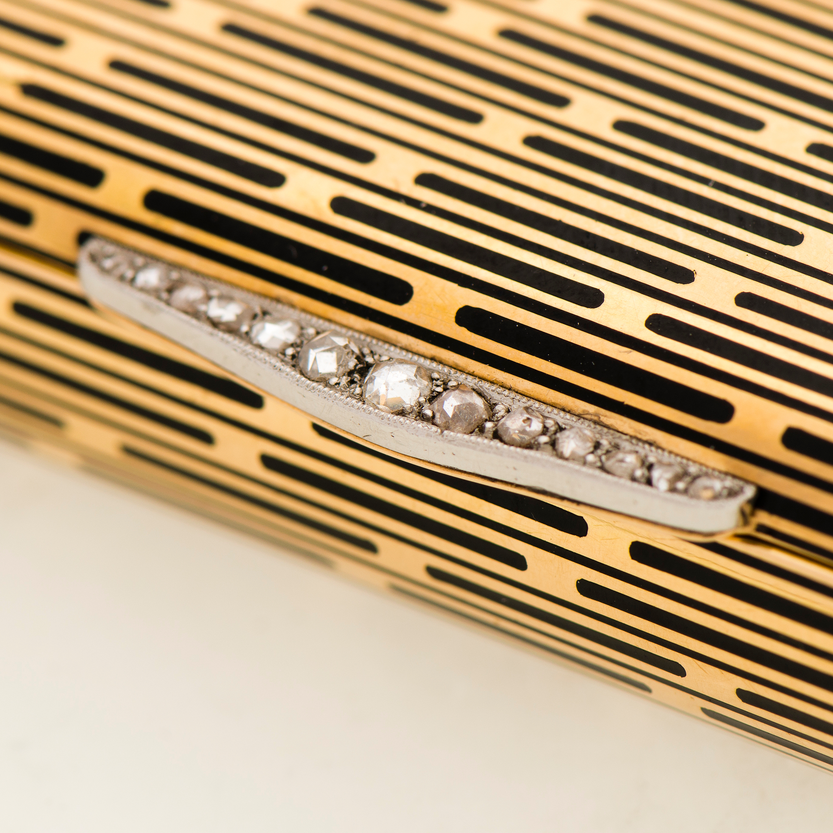 A CARTIER VANITY CASE, 18K gold, enamel, rose cut diamonds. 1930s