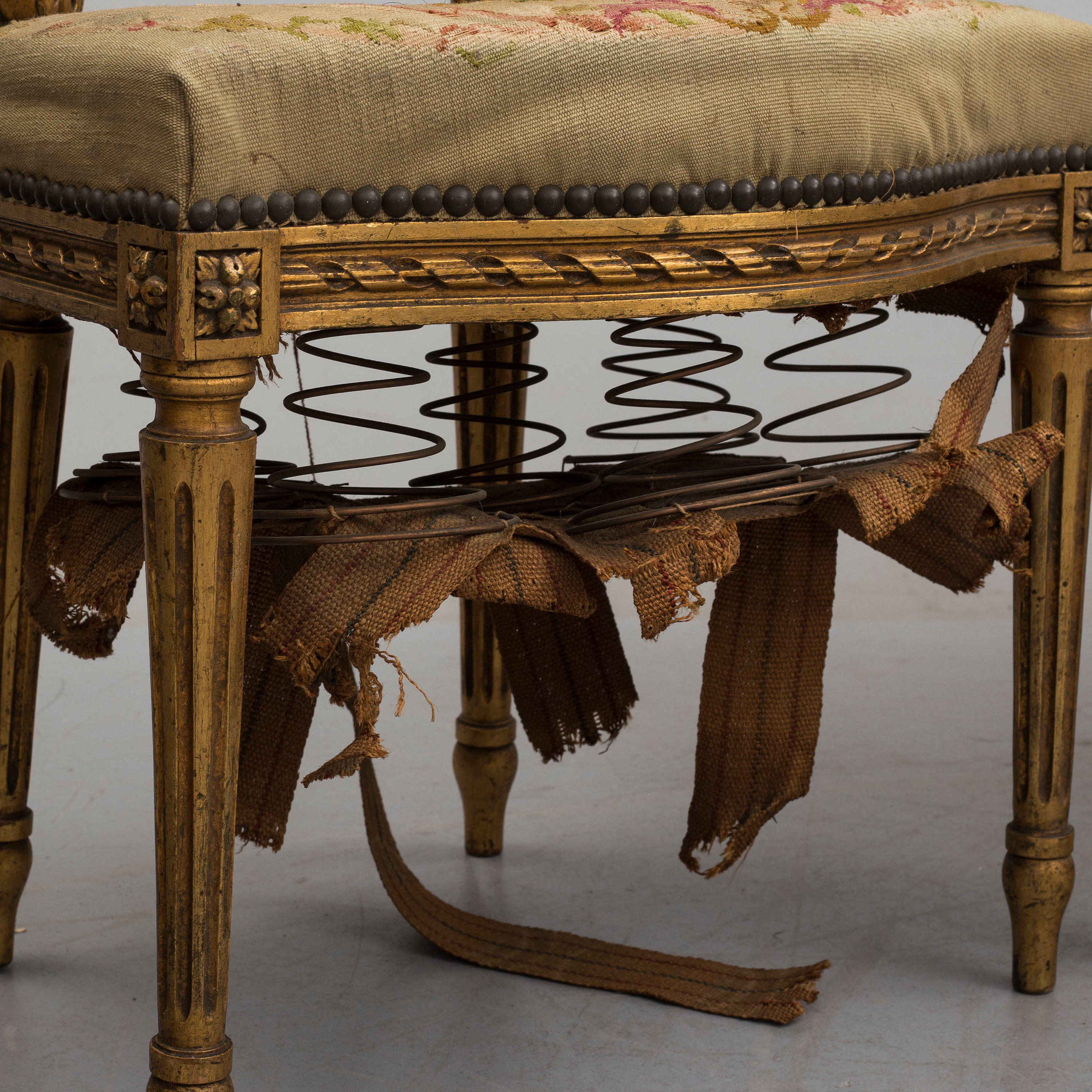 An early 20th century Louis XVI style sofa with two armchairs and two