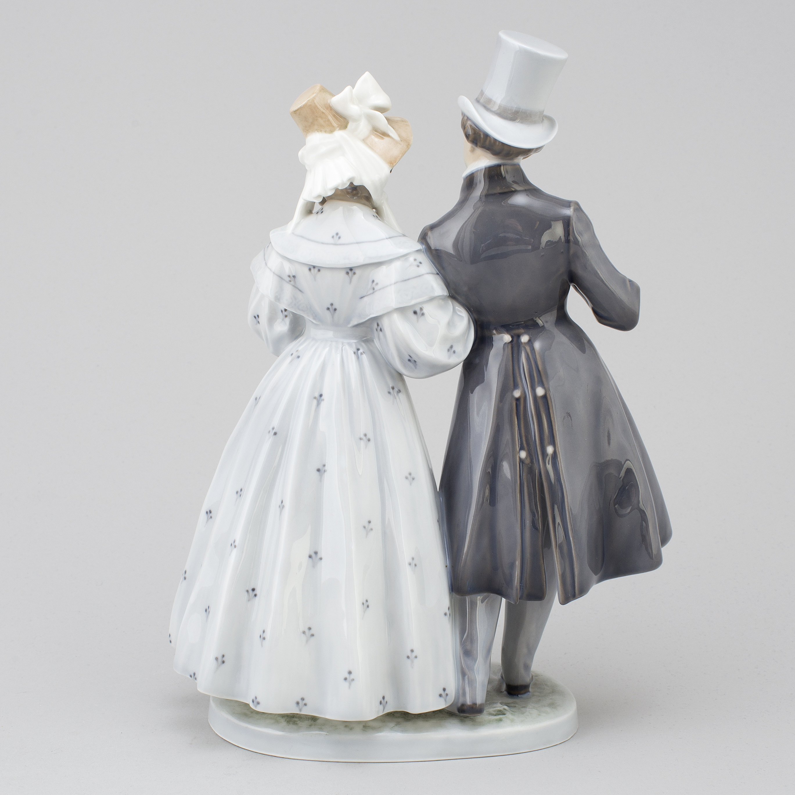A Royal Copenhagen porcelain figurine, 'Victorian couples'. Bukowskis
