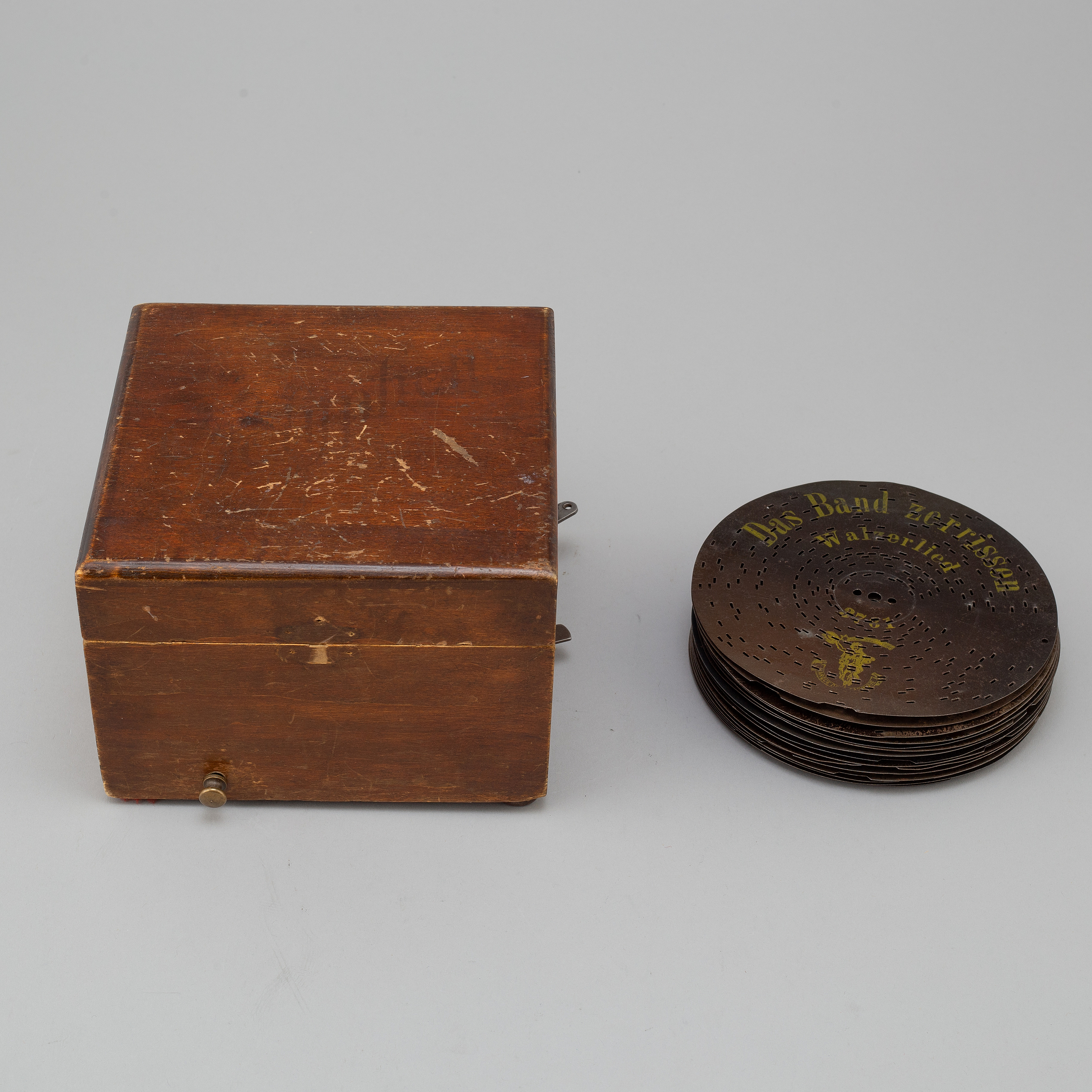 Polyphon wooden music box with fifteen discs, Germany, c. 1900. Bukowskis