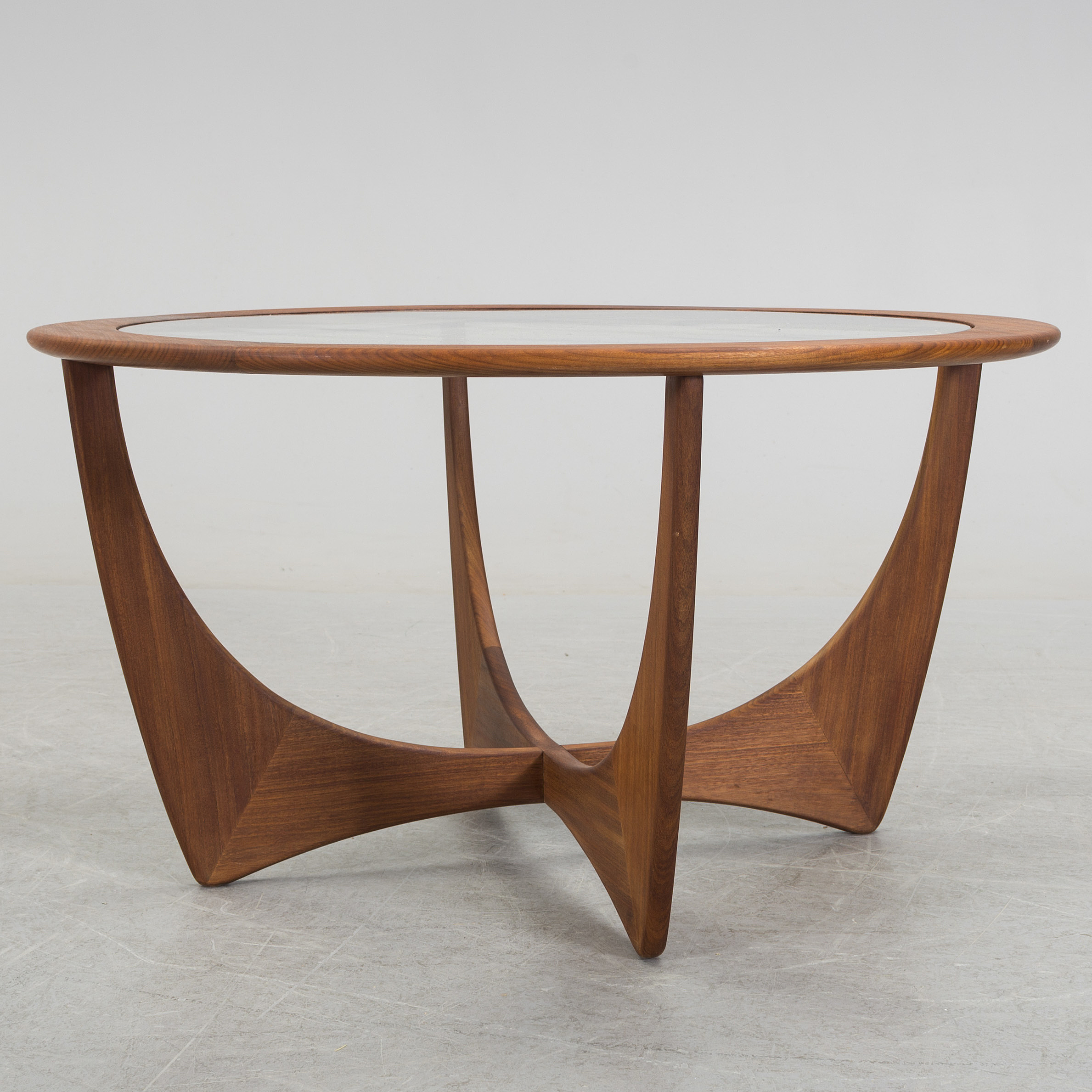 A 20th century teak and glass Gplan ' Astro' table. Bukowskis