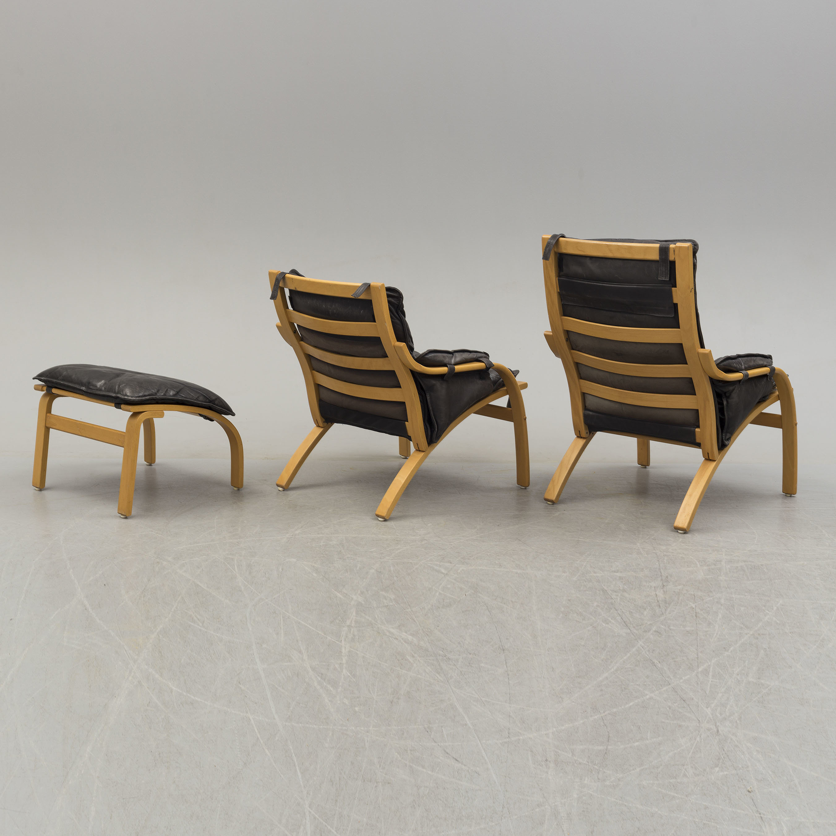 Two easy chairs and stool, second half of the 20th century. Bukowskis