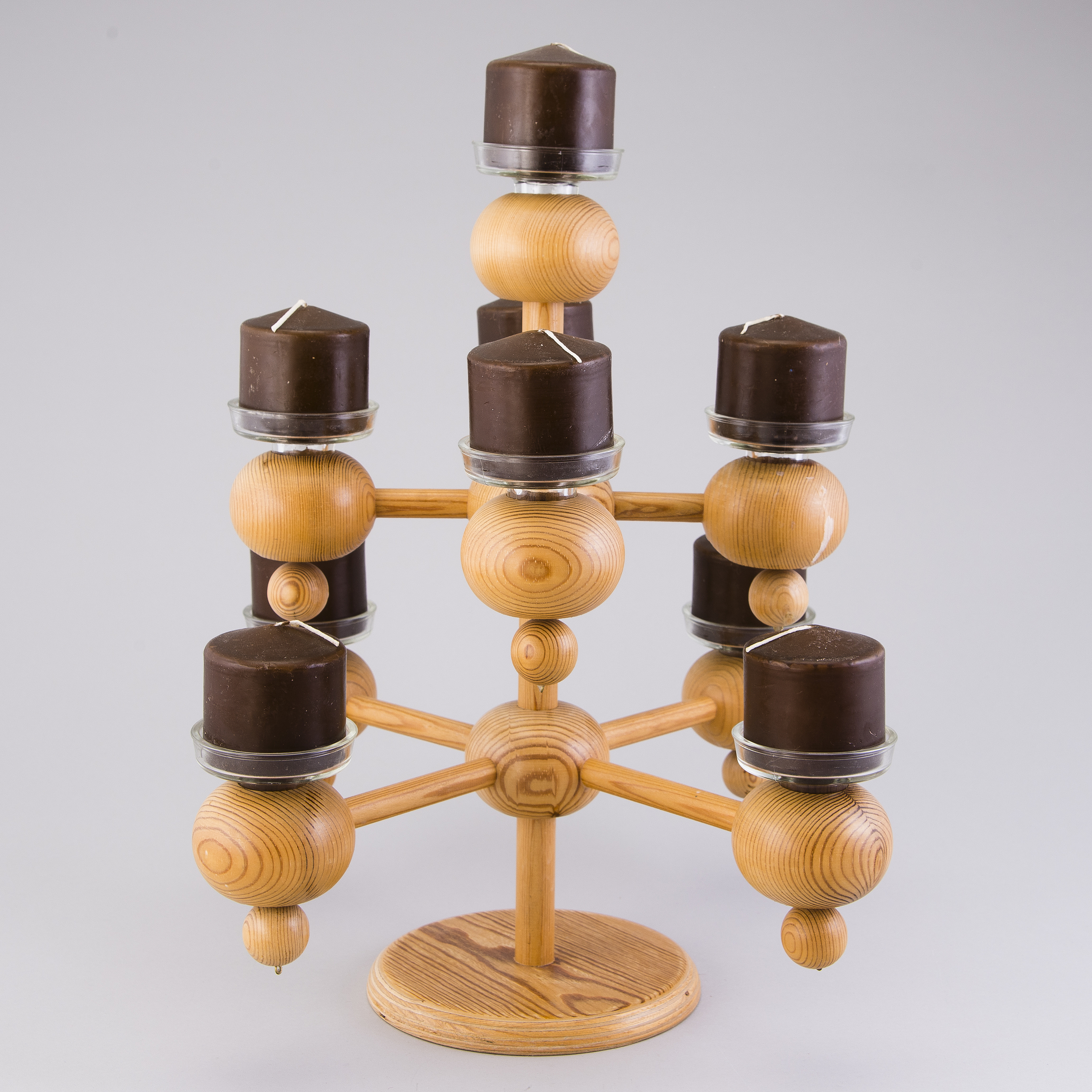 A Finnish wood and glass candelabra, marked Aarikka made in Finland
