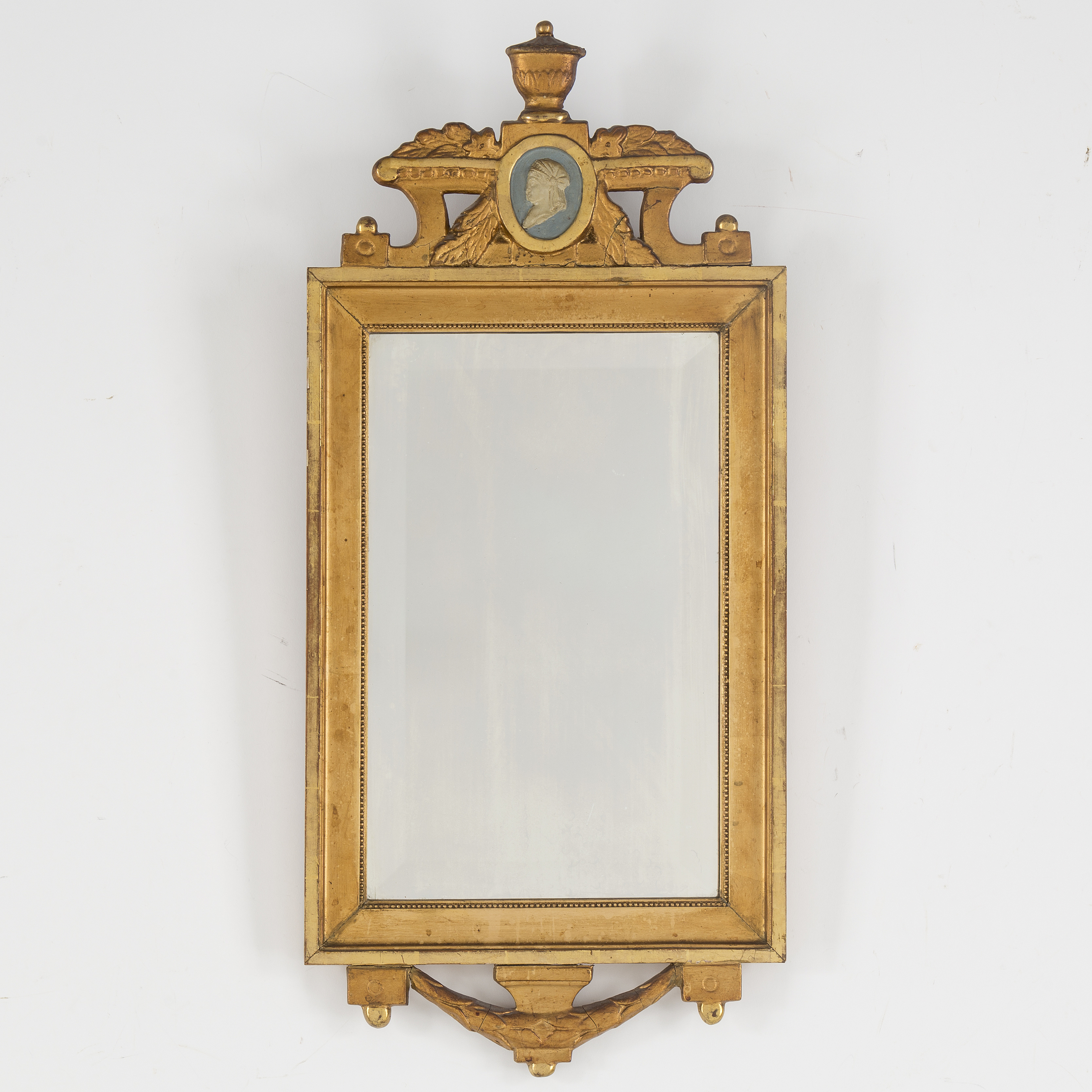 An early 20th century gustavian style mirror. Bukowskis