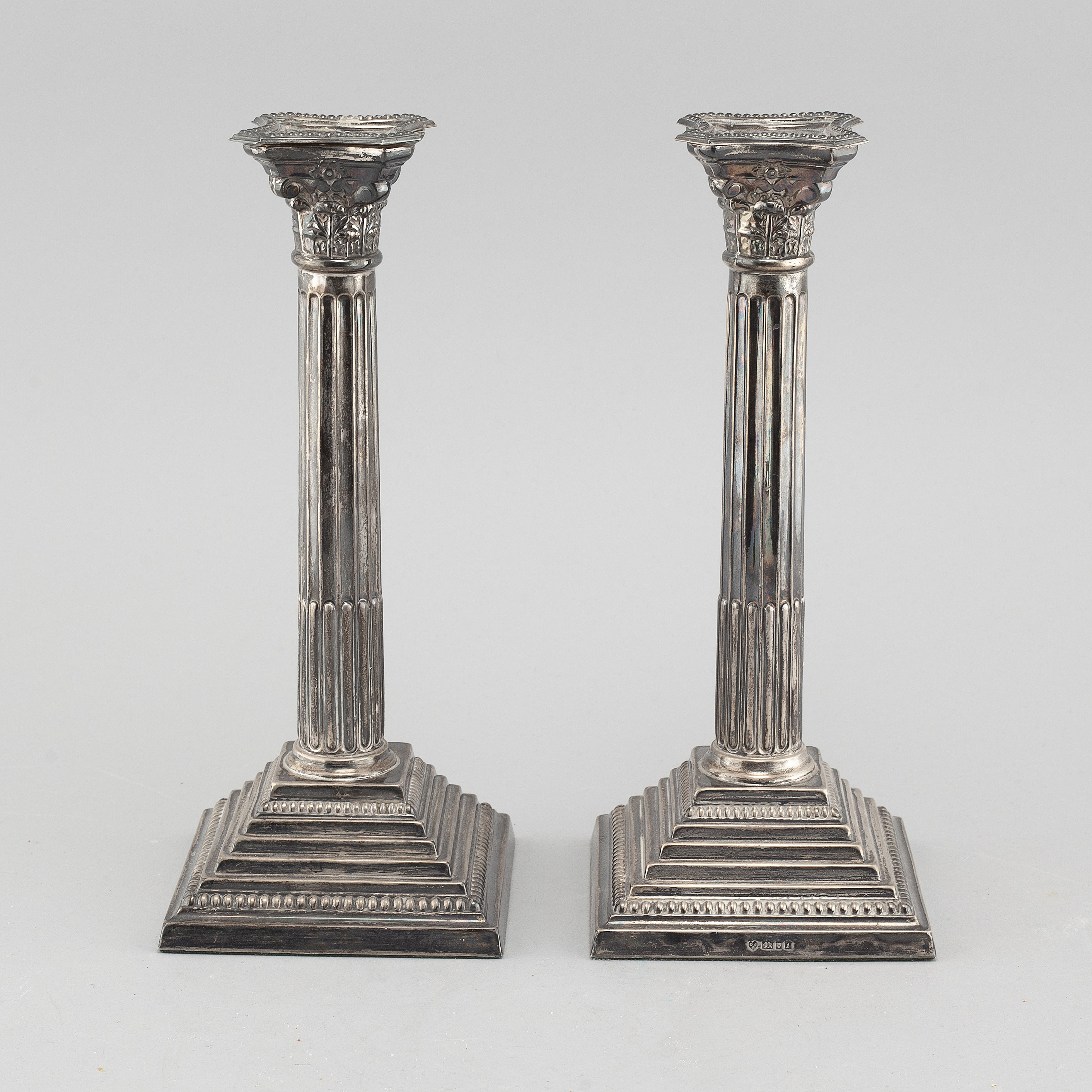 A pair of silver candlesticks made by D J Silver Repairs, Clerkenwell