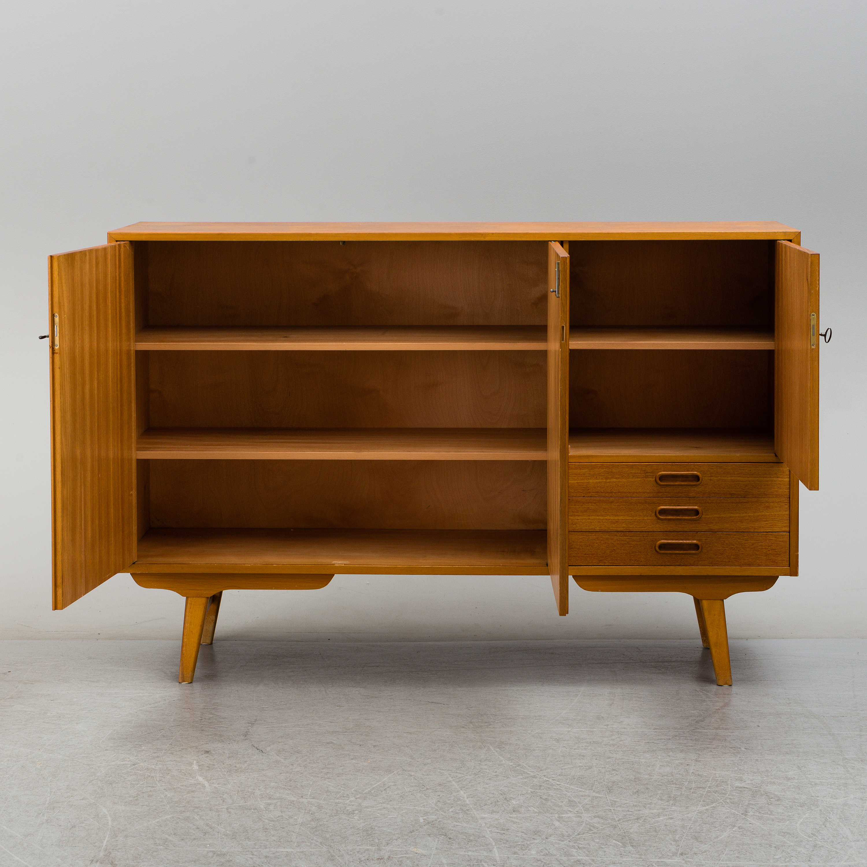 An IKEA teak sideboard, 1950/60's. Bukowskis