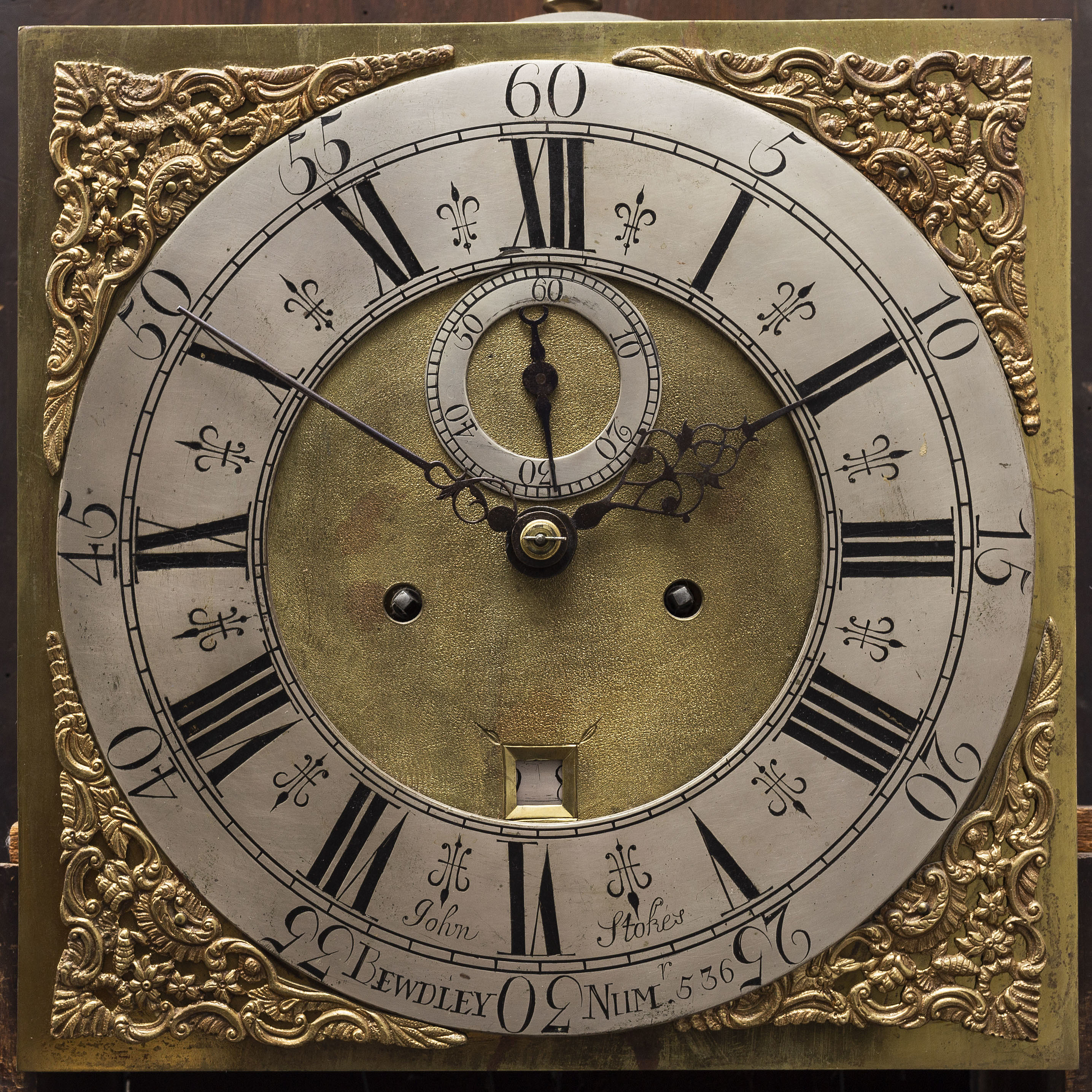 A first half of the 18th Century mahogany long case clock by John