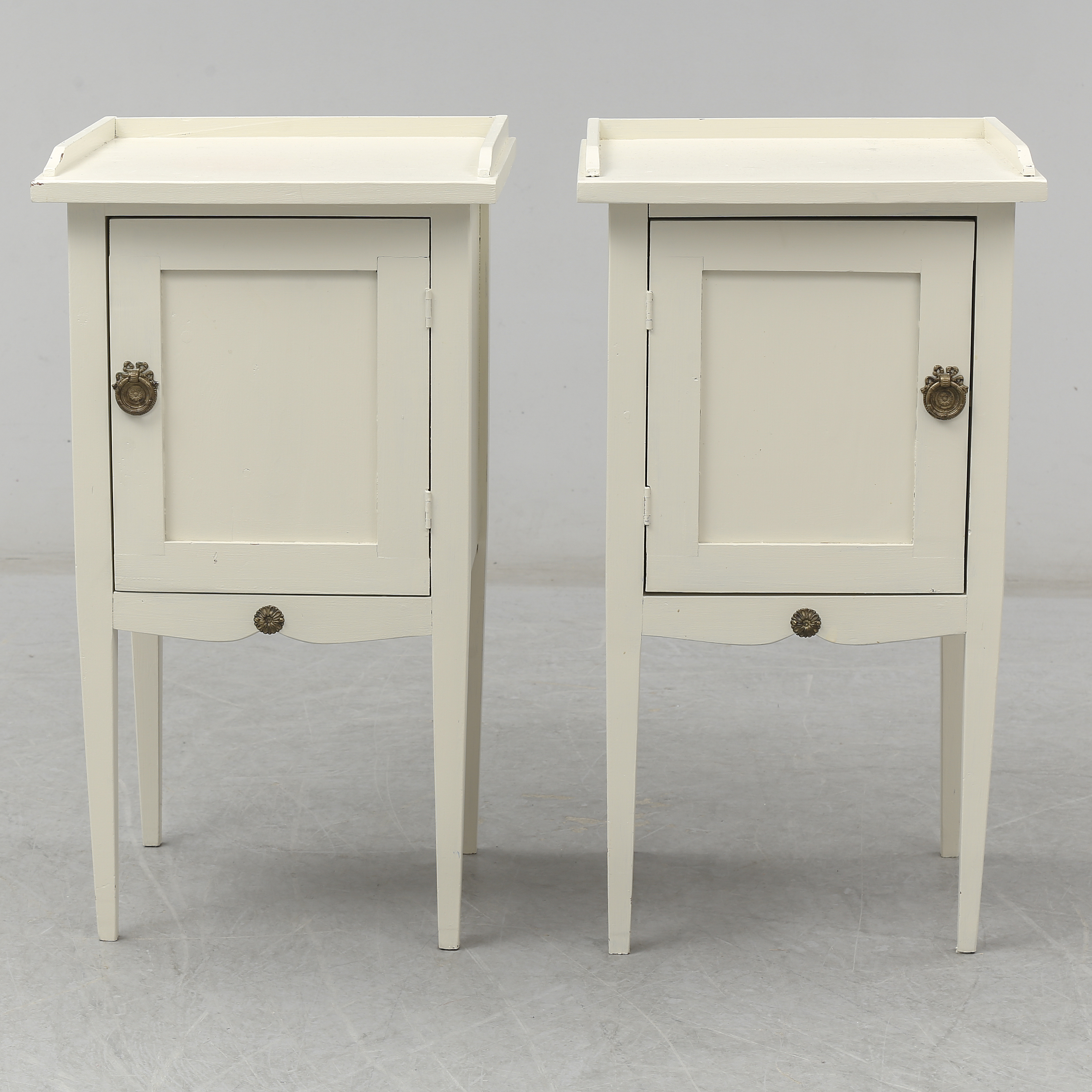 An end of the 20th Century pair of Gustavian style bedside tables