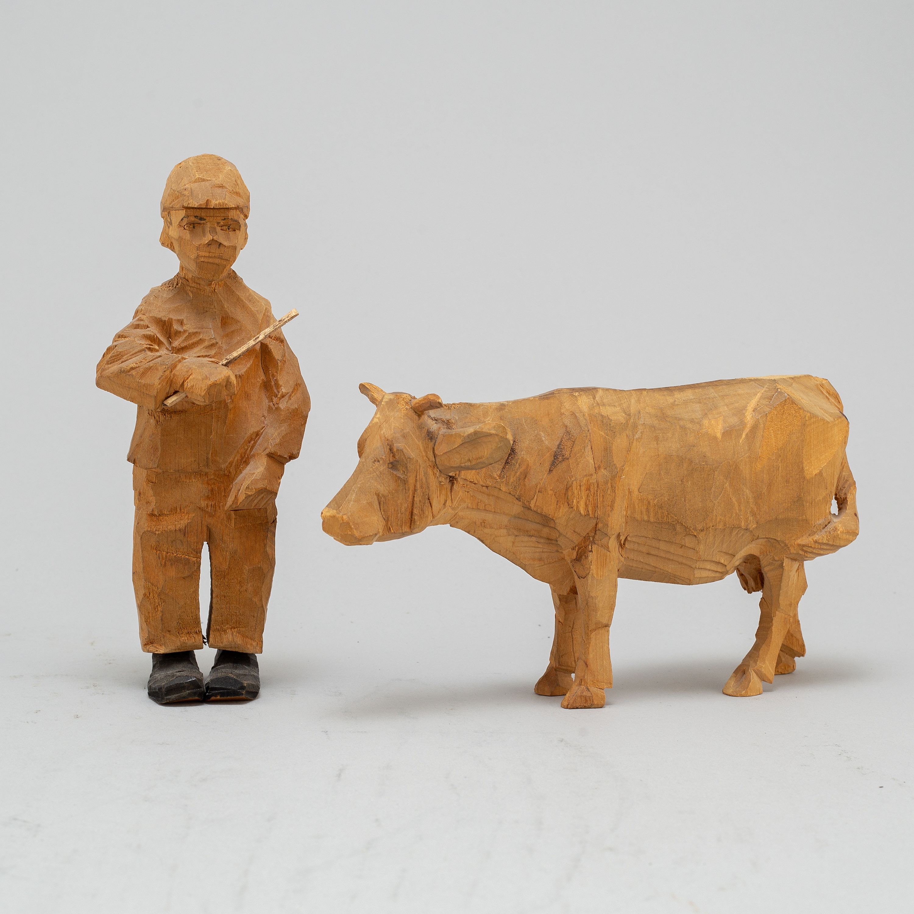 AXEL PETERSSON DÖDERHULTARN, two carved wooden sculptures, signed