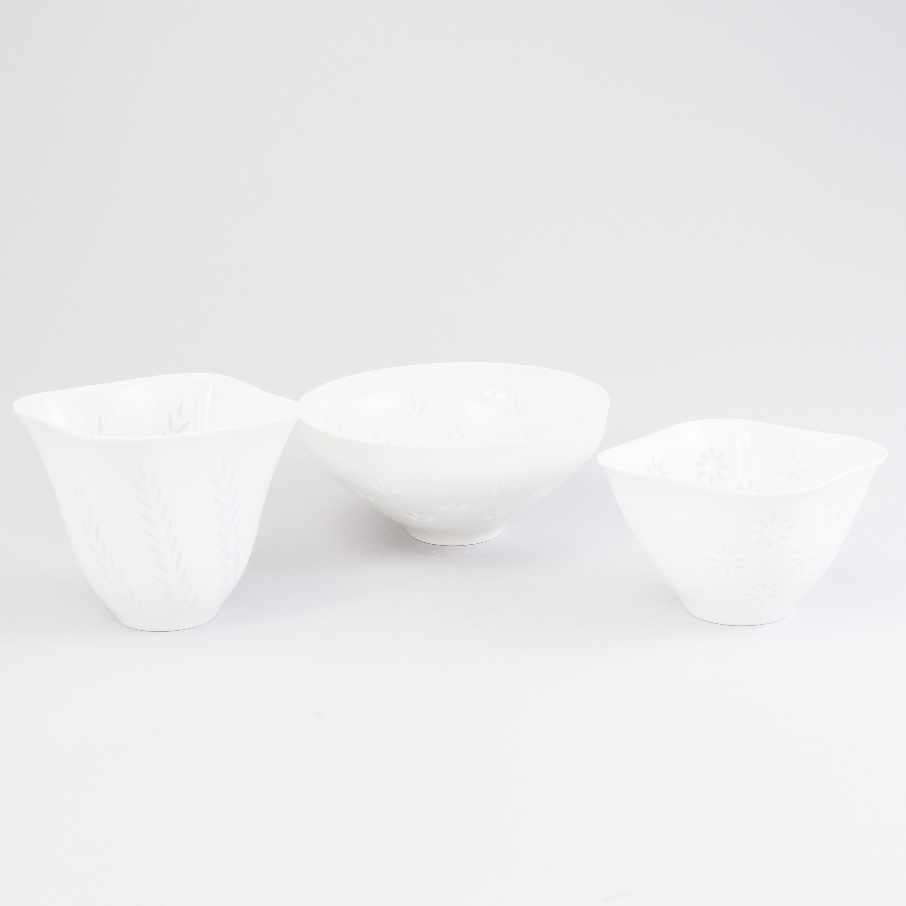 FRIEDL HOLZERKJELLBERG, Three rice grain porcelain bowls, two signed