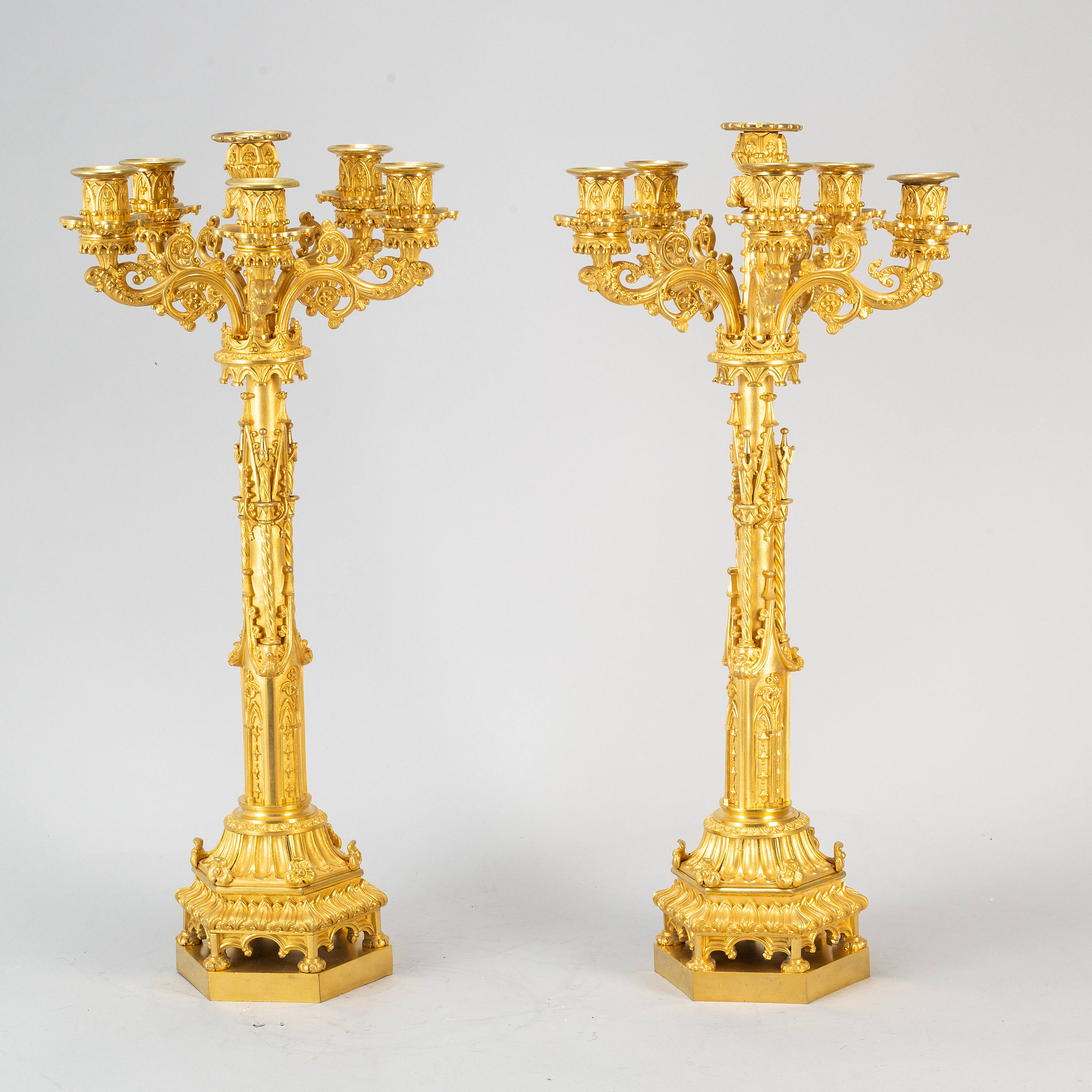 A pair of Gothic Revival gilt bronze candelabra, mid 19th century