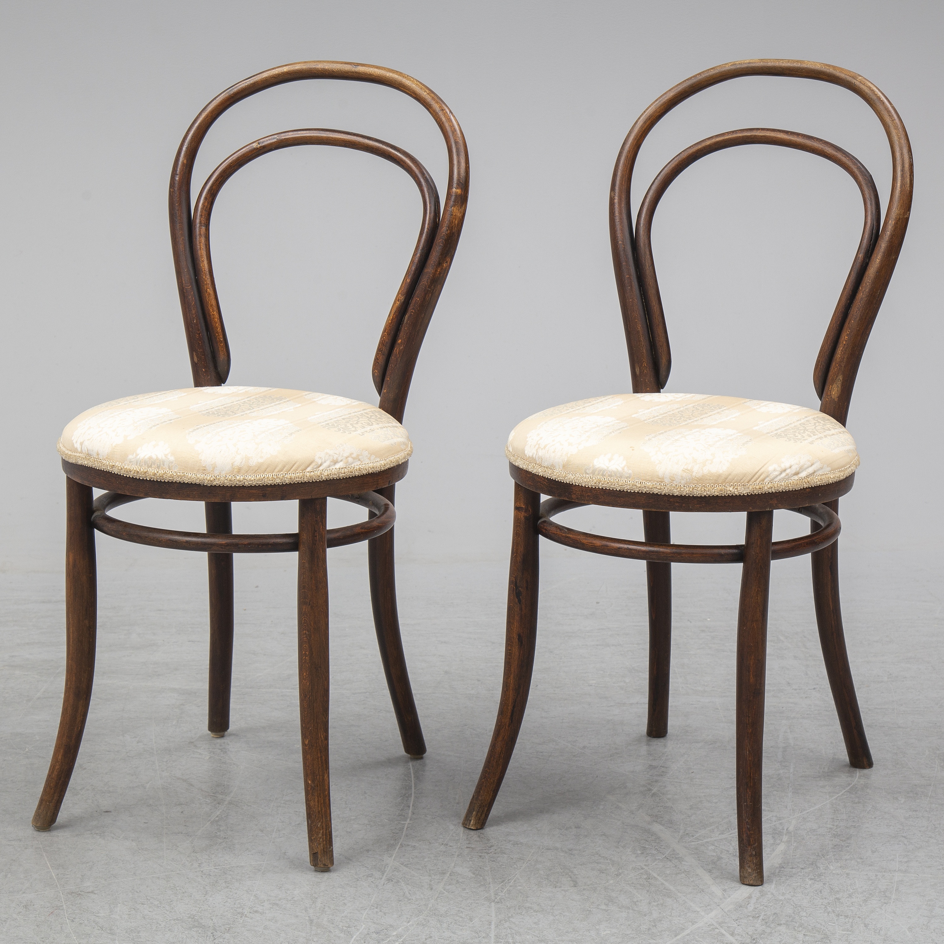 A pair of german chairs, early 20th century. Signed with labels