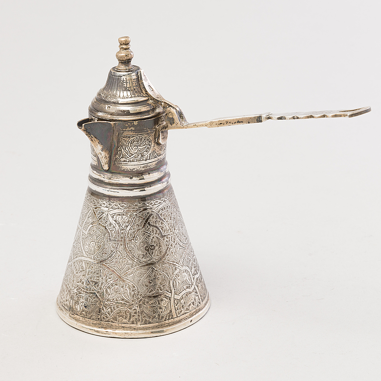 A 1970s Egyptian coffee set in silver and glass. Bukowskis