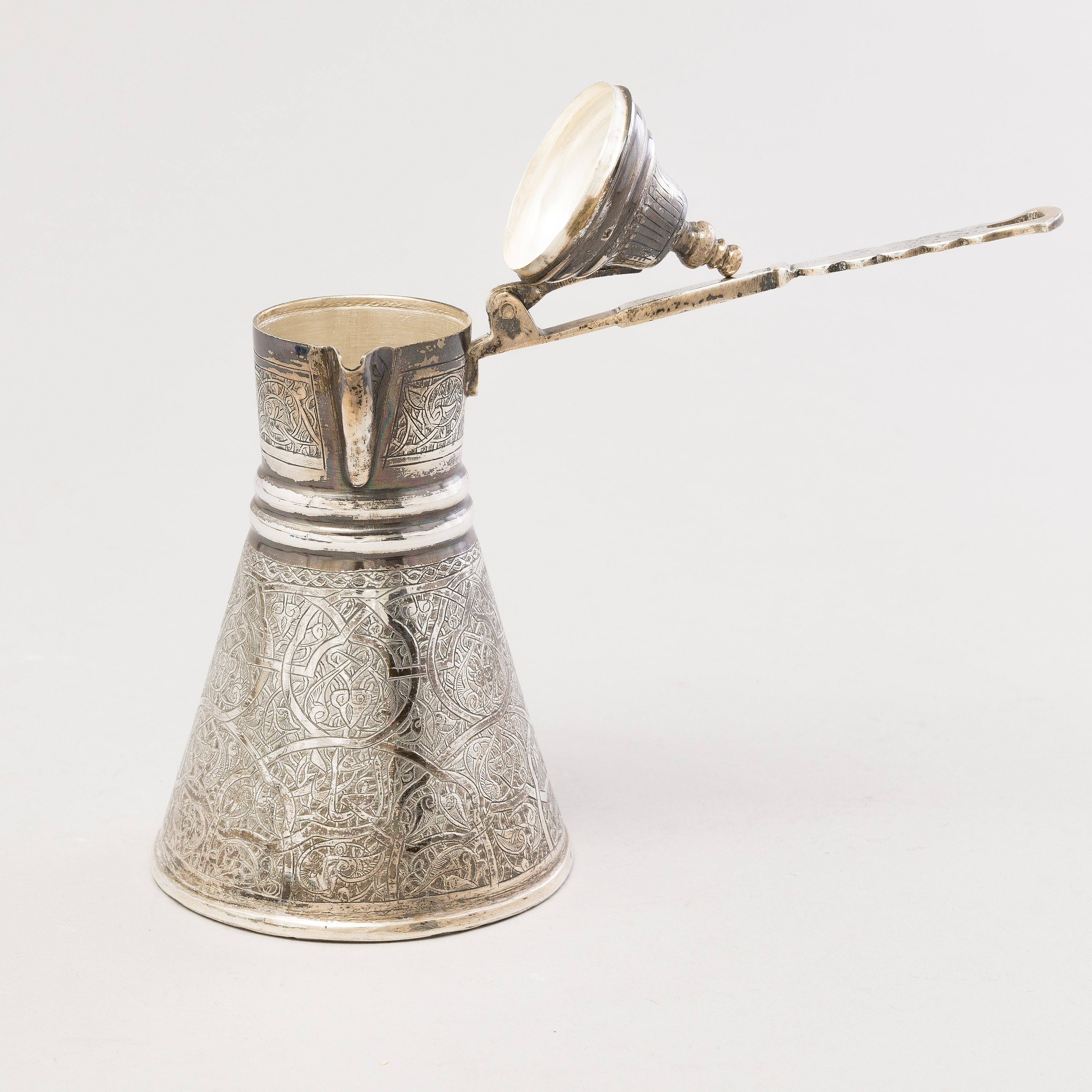 A 1970s Egyptian coffee set in silver and glass. Bukowskis