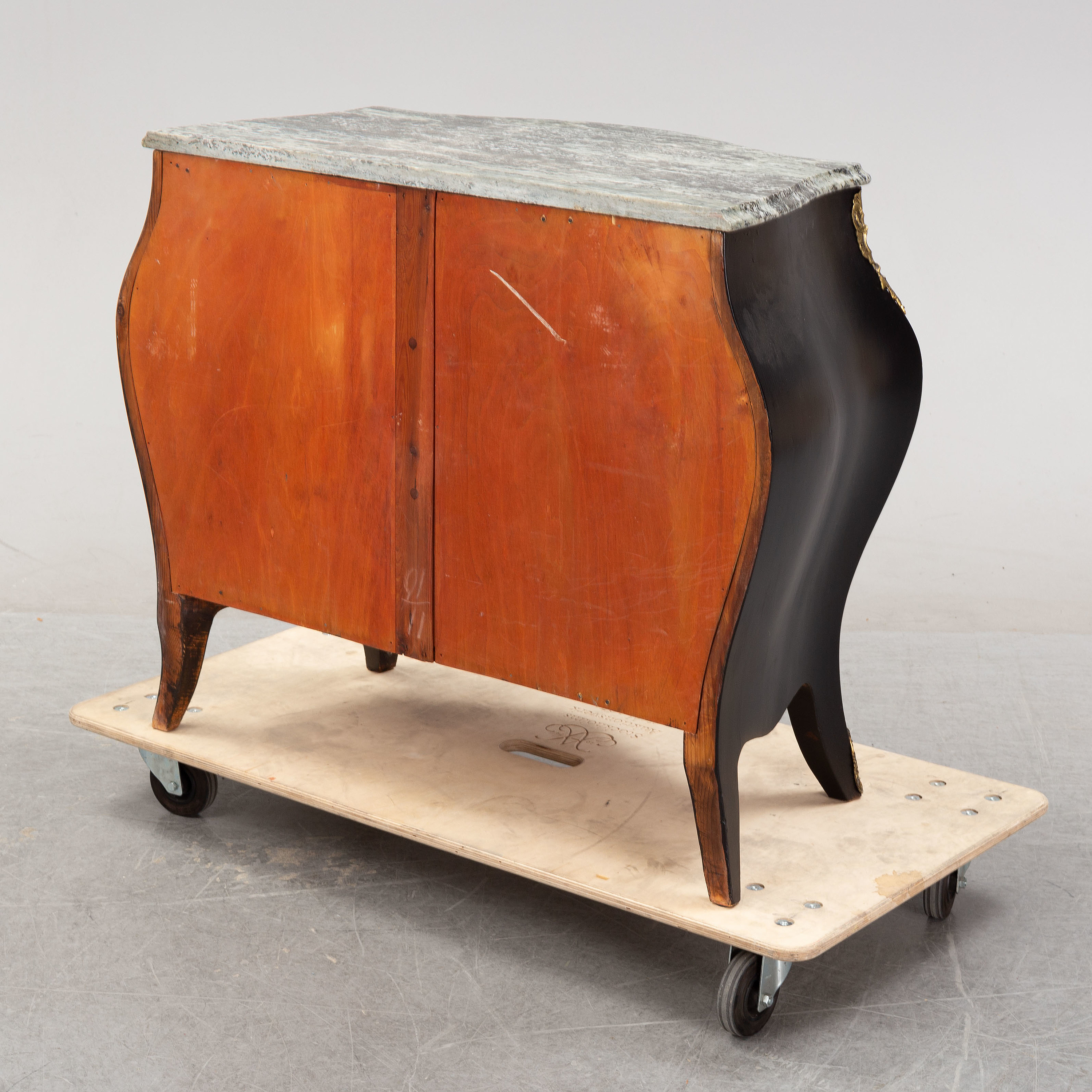 A Rococo style stone top chest of drawers, mid 20th Century. Bukowskis