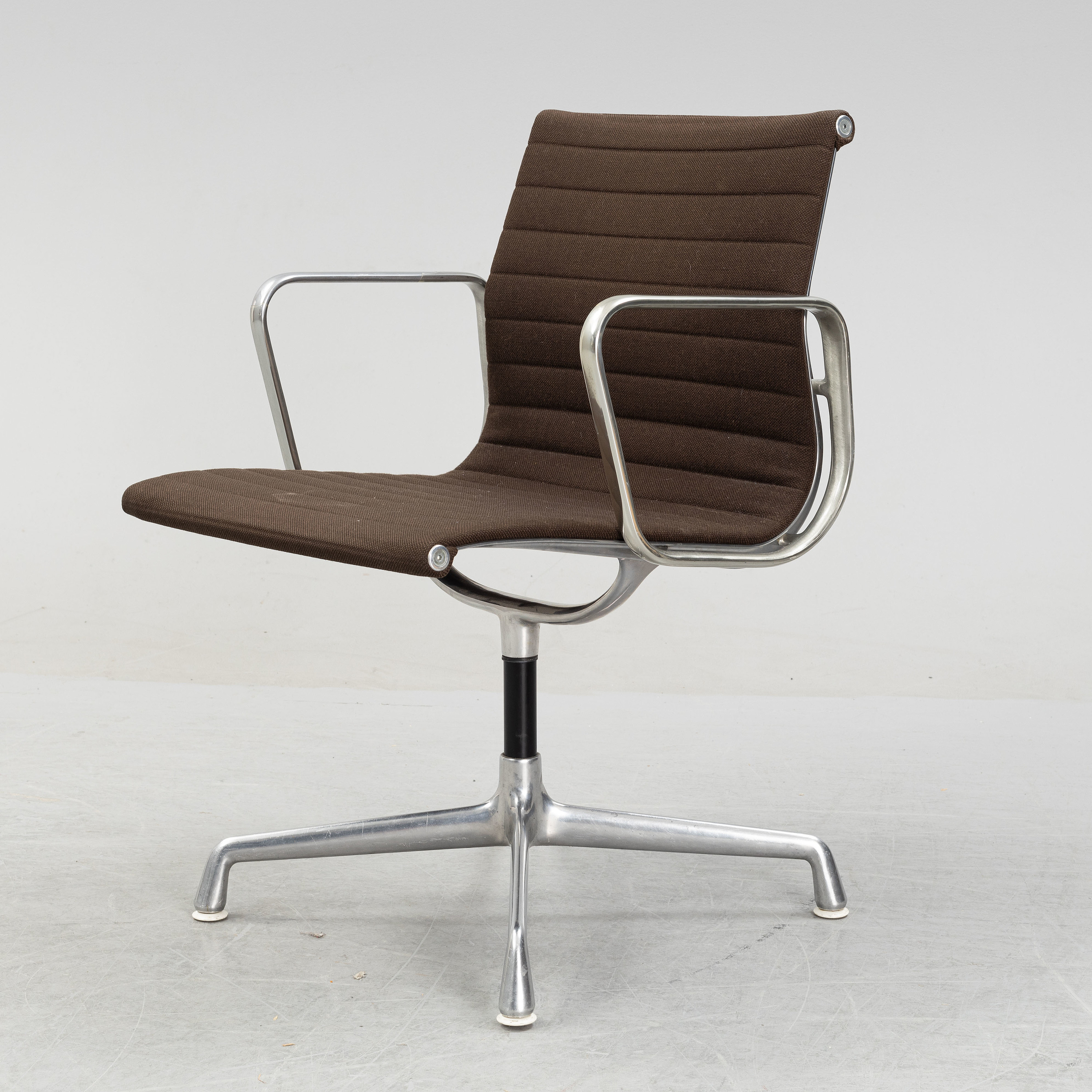 A model EA 108 swivel armchair by Charles and Ray Eames for Herman Miller, designed 1958 