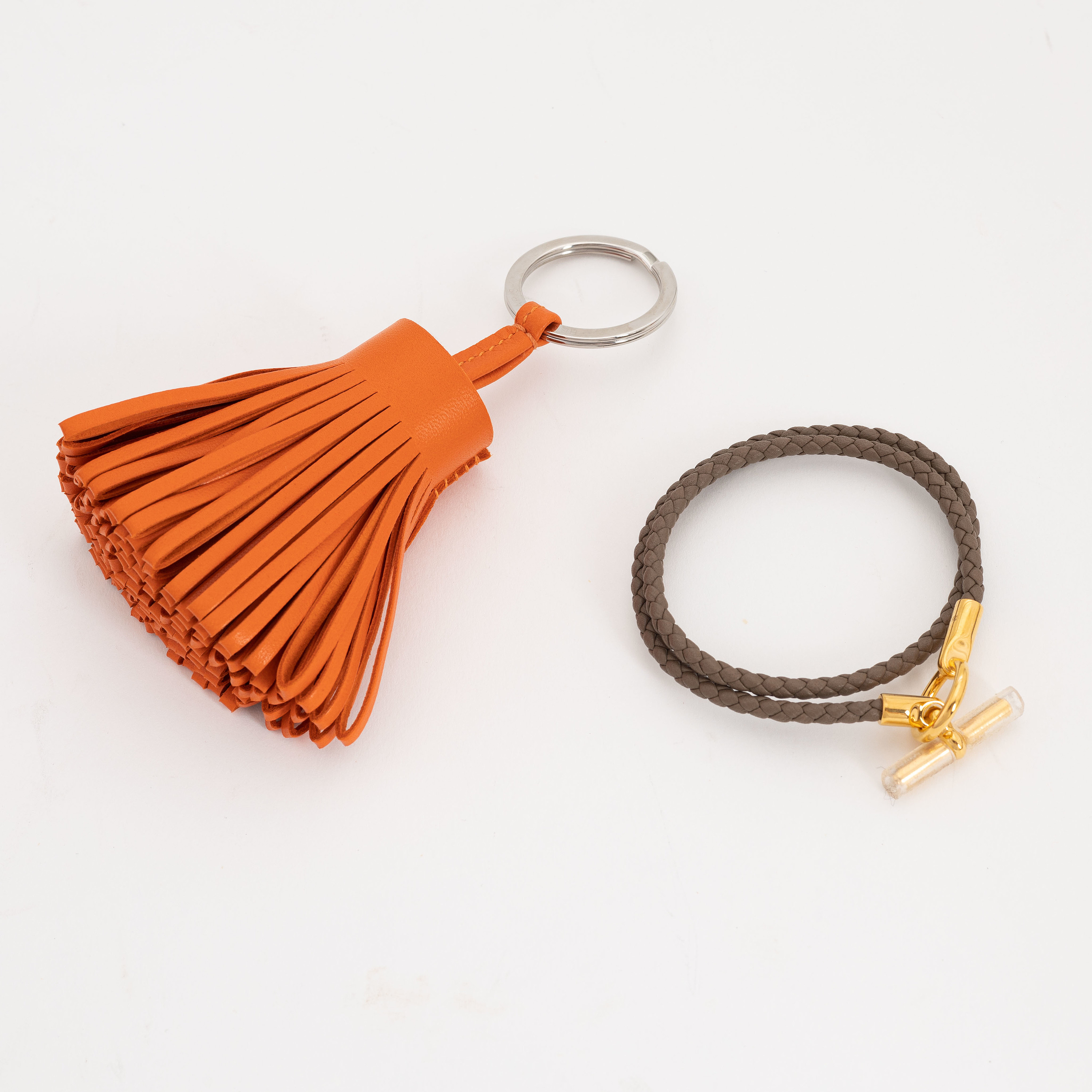 Hermès, a leather bracelet and key chain. Bukowskis