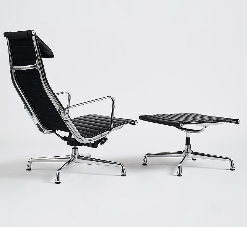 Charles and Ray Eames, an armchair and ottoman, Aluminium group model "EA 316", Vitra, 21st century.