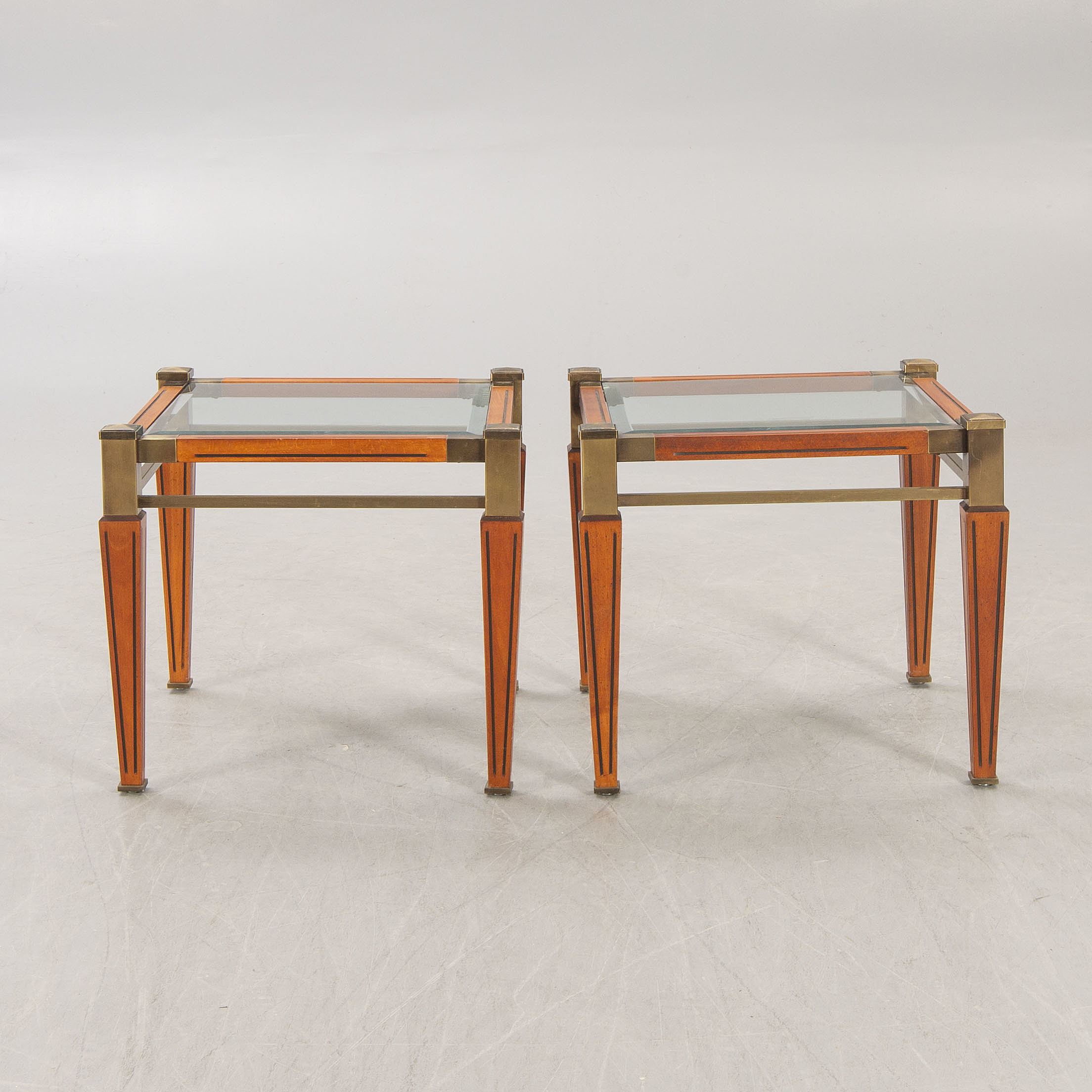 A pair of brass and wood side tables later part of the 20th century
