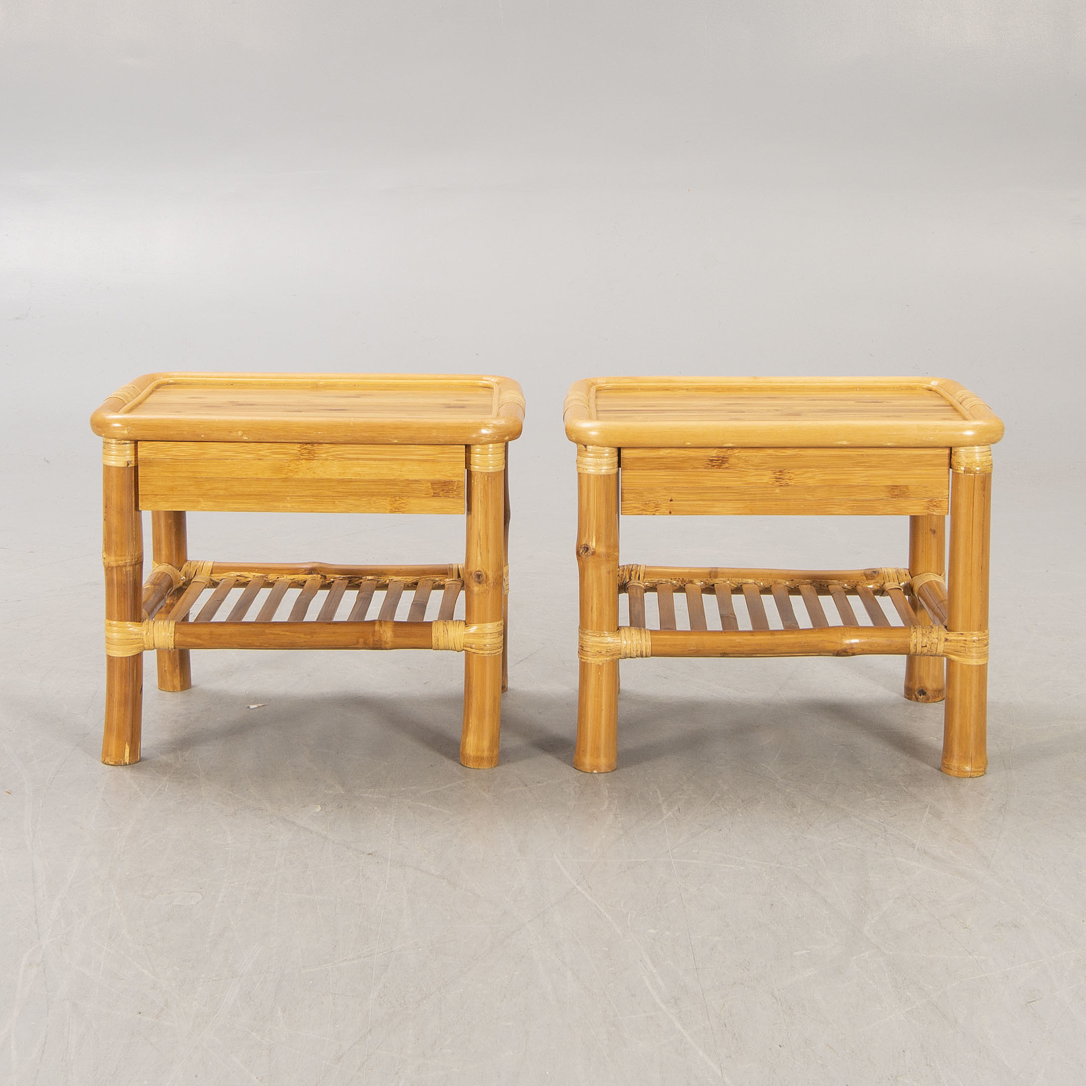 A pair of bamboo and rattan bedside tables. Bukowskis