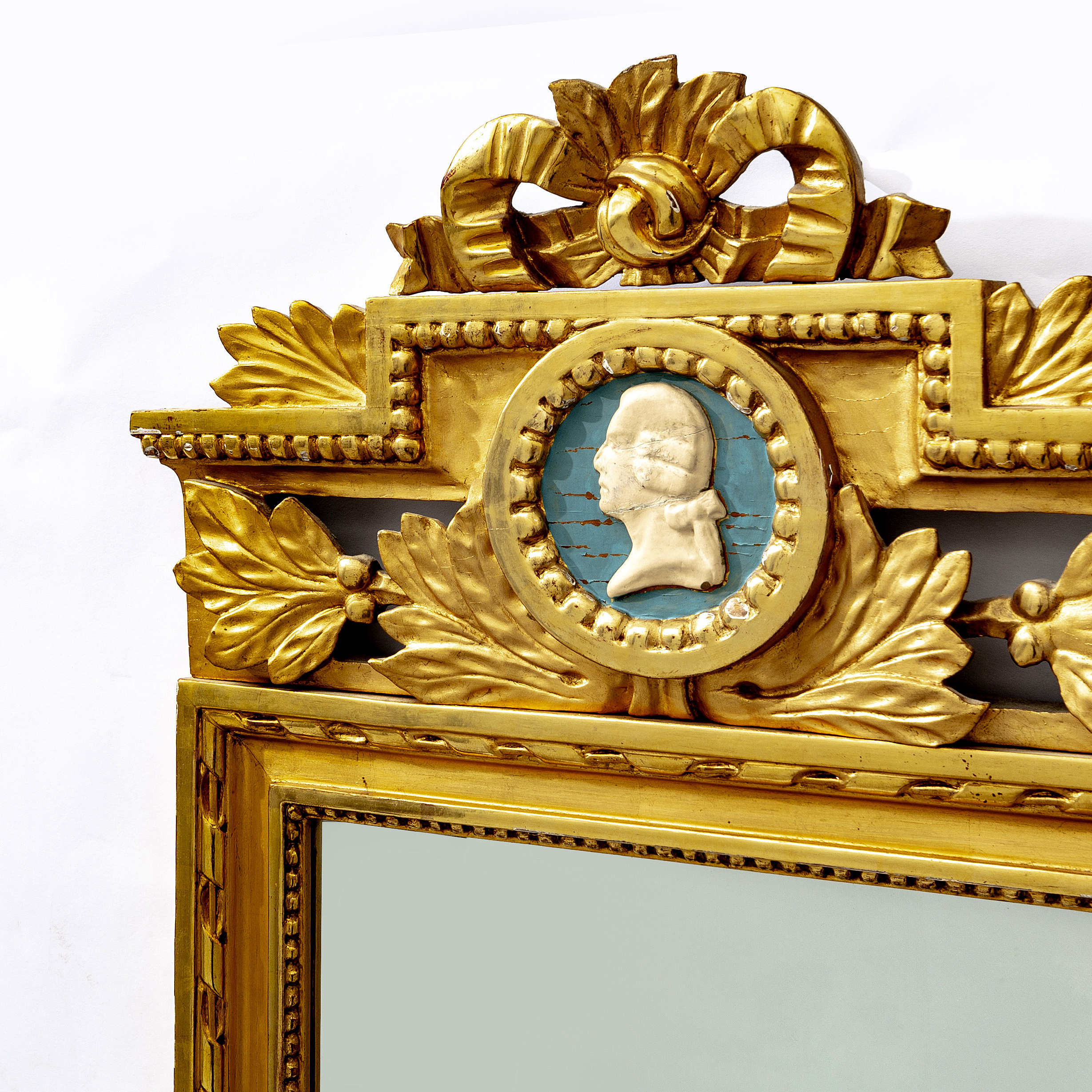 A gilded mid 1900s Gustavian style mirror. Bukowskis