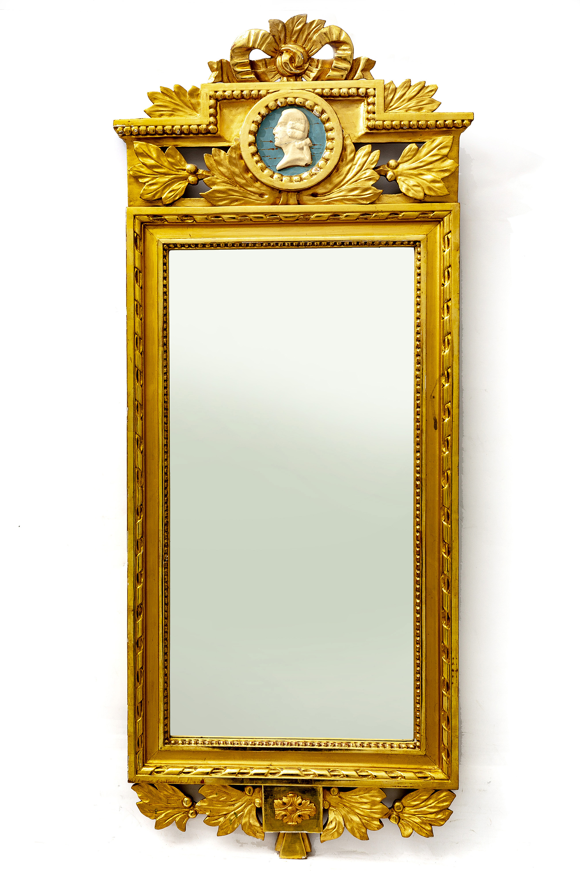 A gilded mid 1900s Gustavian style mirror. Bukowskis