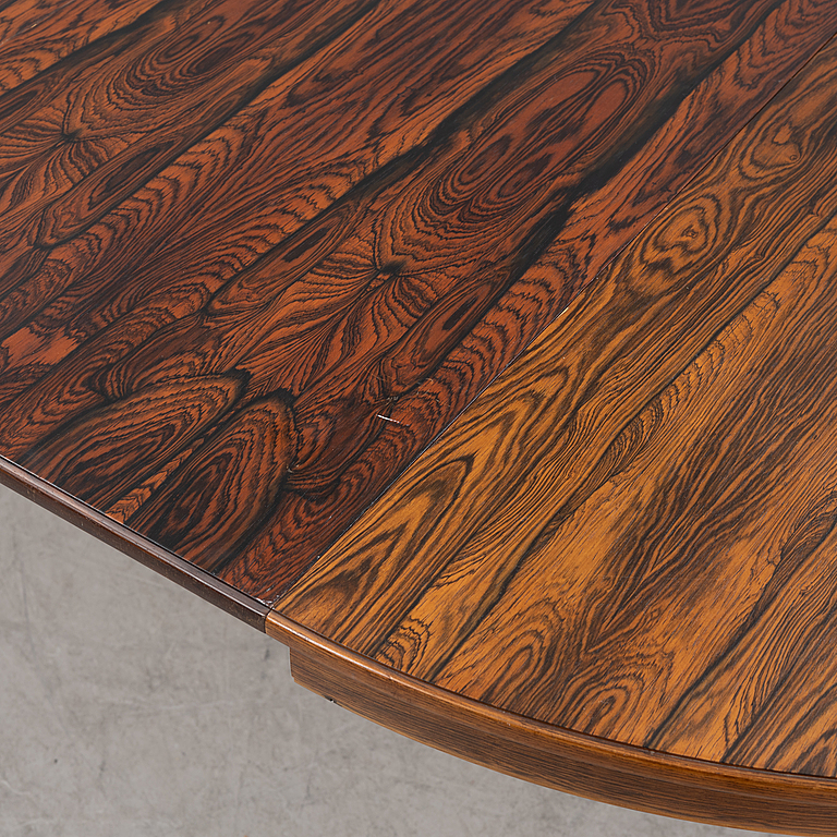 A 1960's/70's rosewood veneered dining group.