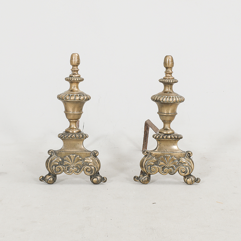 A pair of French metal chenets later part of the 19th century.