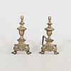 A pair of French metal chenets later part of the 19th century.