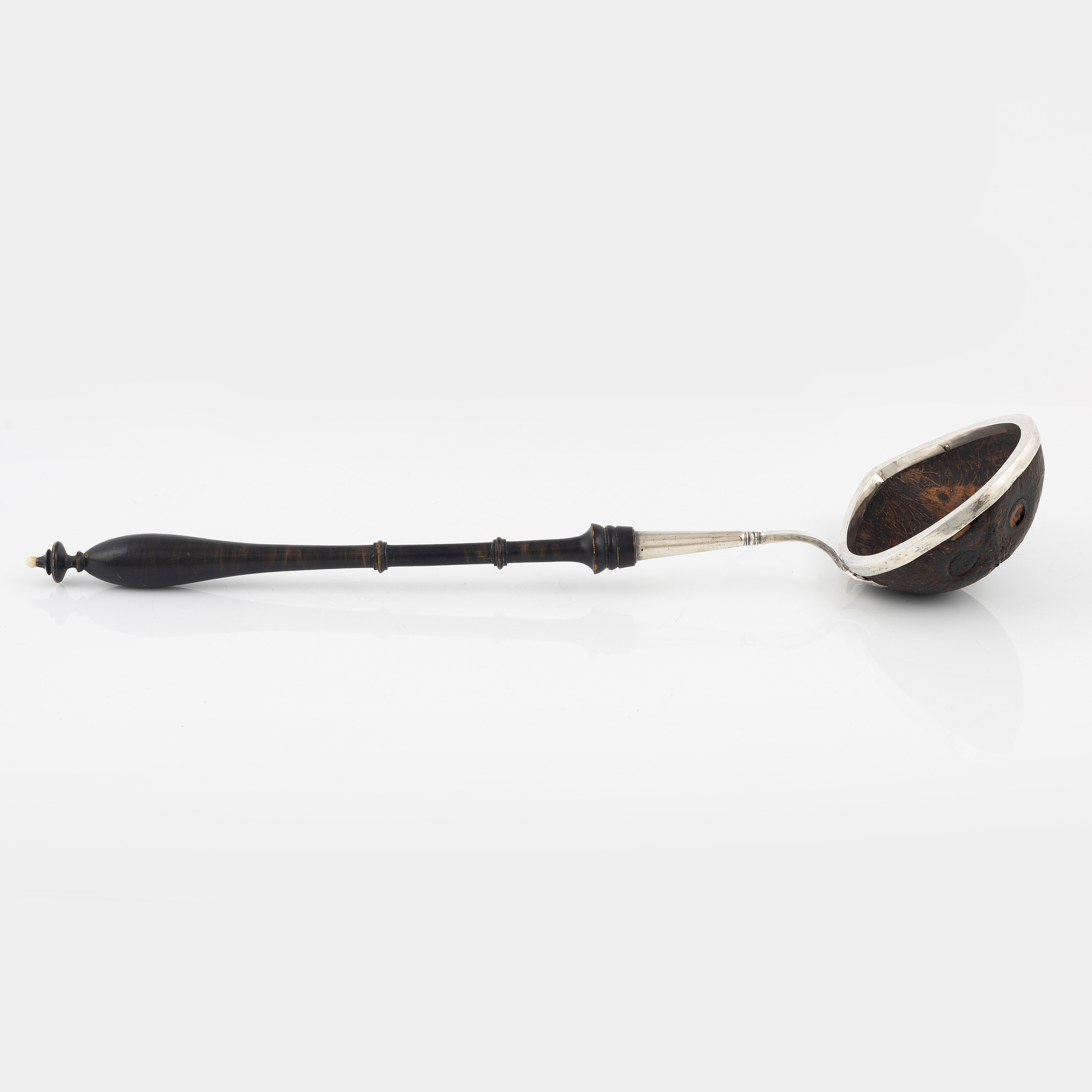 A silver mounted soup ladle with a coconut cup. Bukowskis