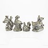 A set of four pewter icecream moulds around 1900.