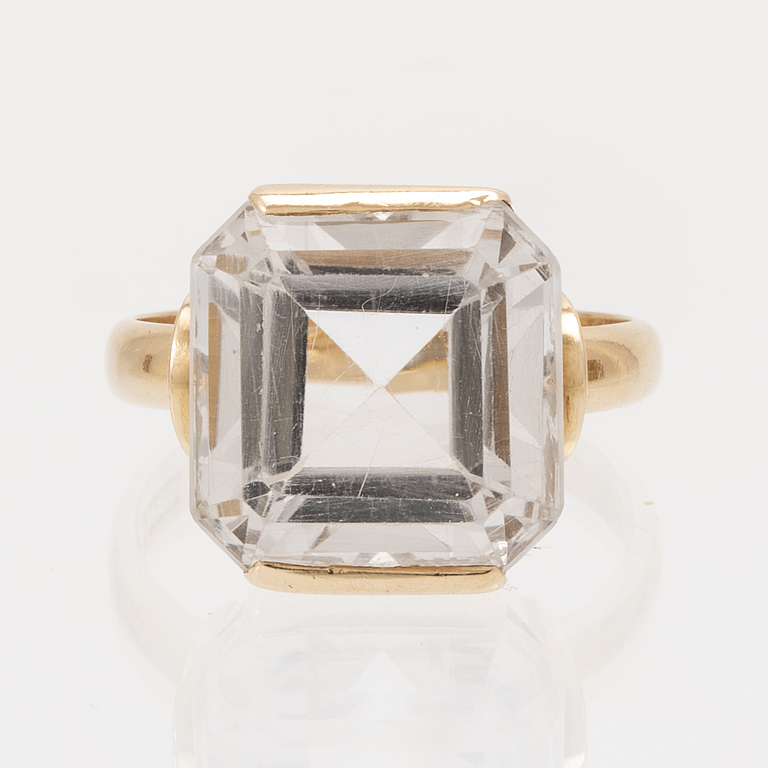 A set of 18K gold earrings and ring with faceted rock quartz crystal.