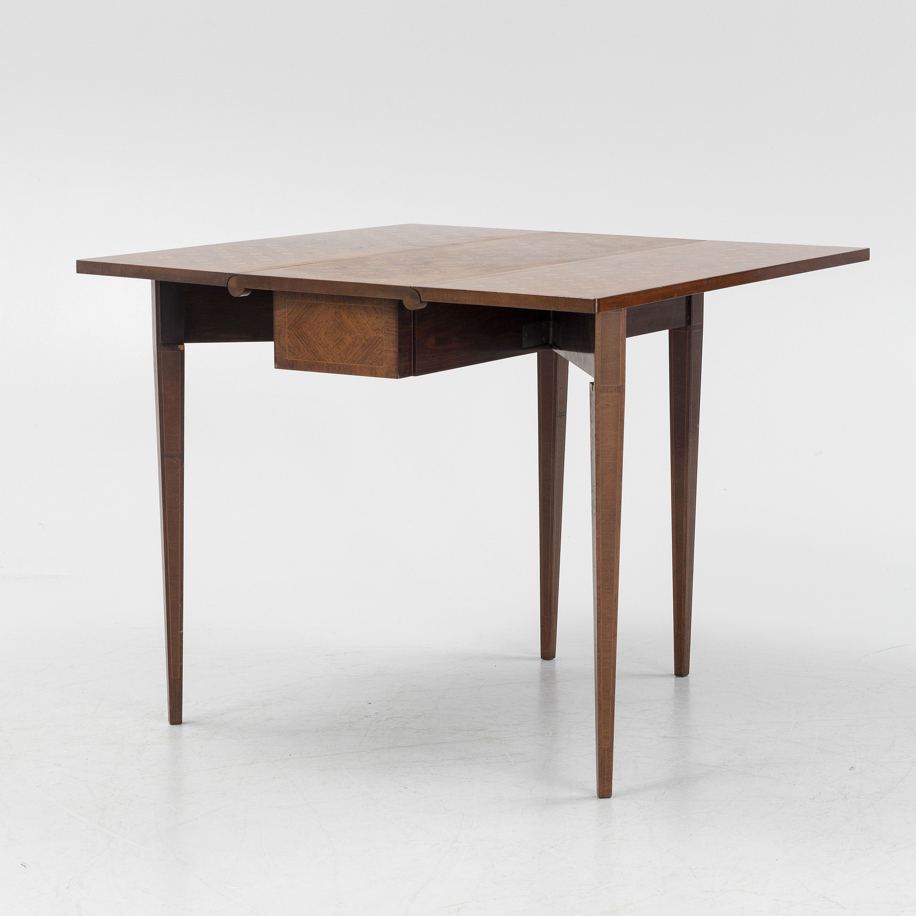 A Gustavian style table with folding leaves, first half of the 20th