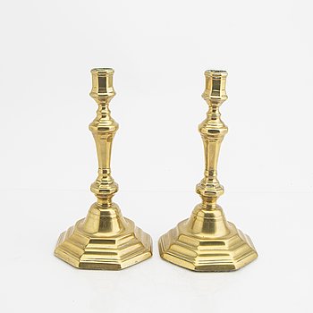 A pair of 18th century brass candle sticks.