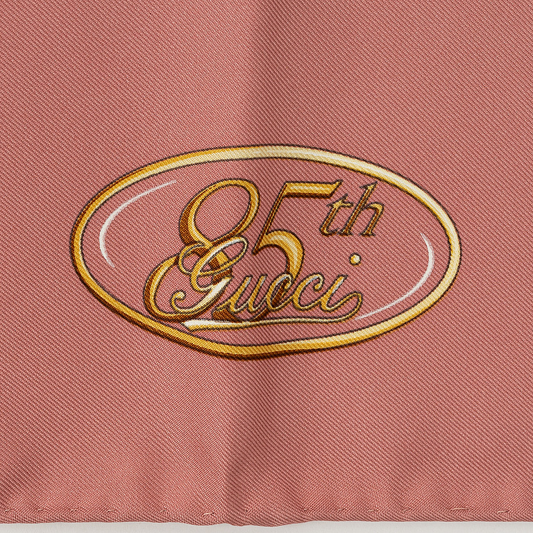 Gucci, a silk scarf.