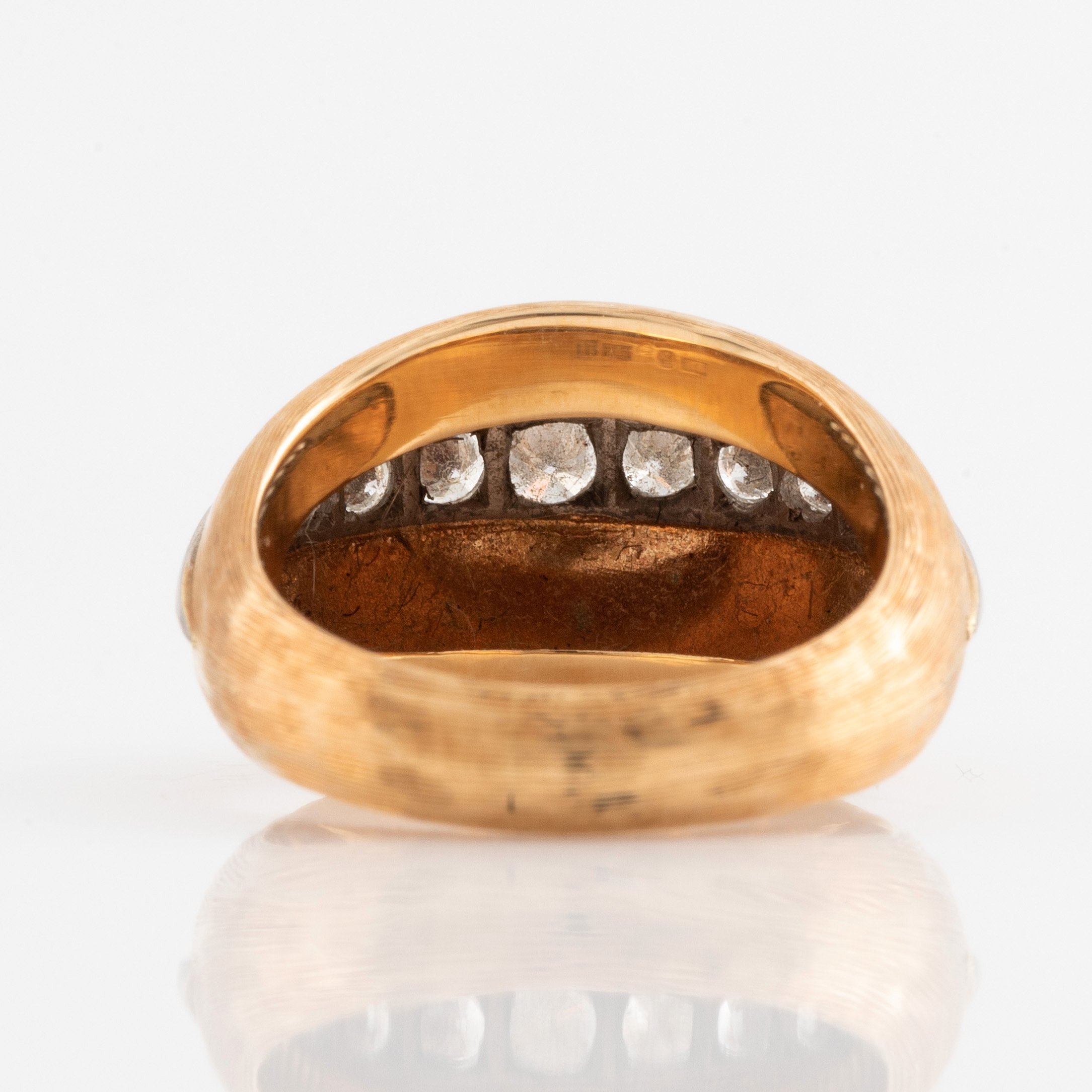 An 18K gold ring set with round brilliant-cut diamonds by CF Carlman ...