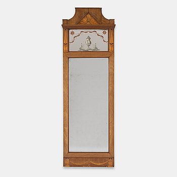 An Empire style mahogany-veneered mirror, around 1900.