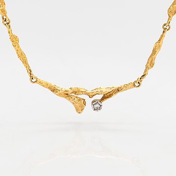 Björn Weckström, An 18K gold necklace "Spring dew" with a ca. 0.08 ct diamond. Lapponia 1979.