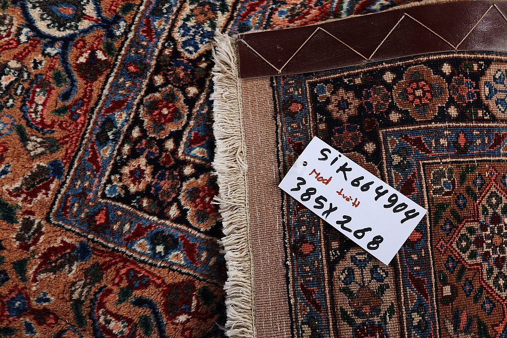 A carpet, Moud, signed, ca 385 x 268 cm.