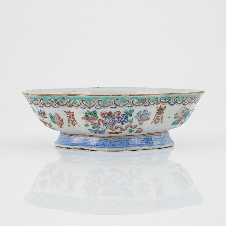 A set of four Chinese Export plates, 18th Century and a bowl, late 19th Century.