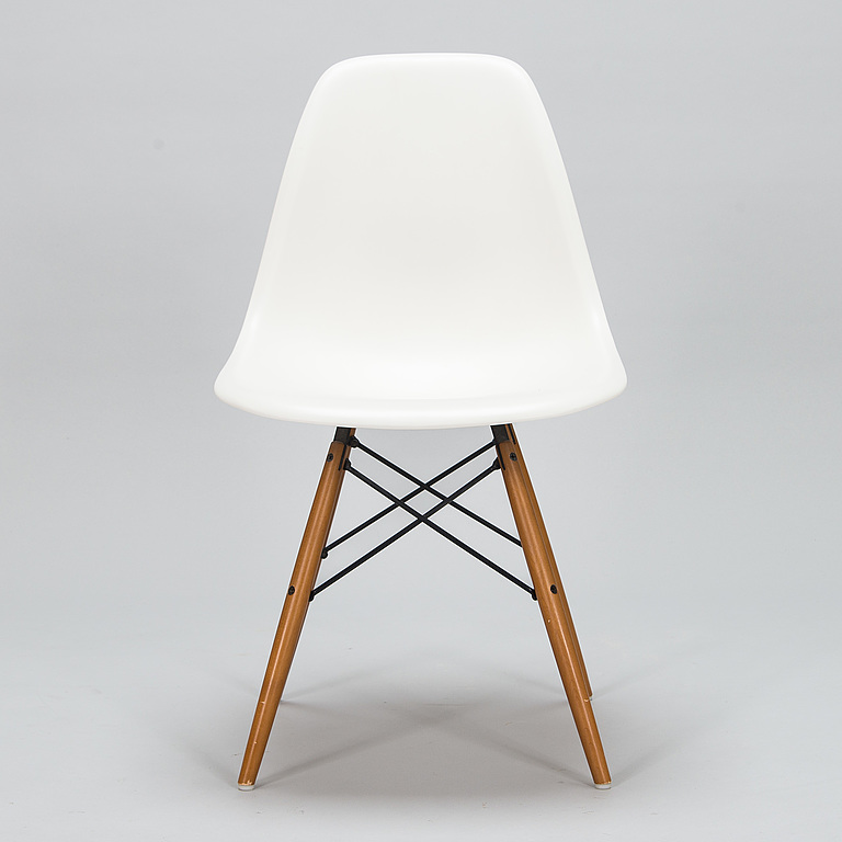 A 'Plastic chair DSW' by Charles and Ray Eames for Vitra.