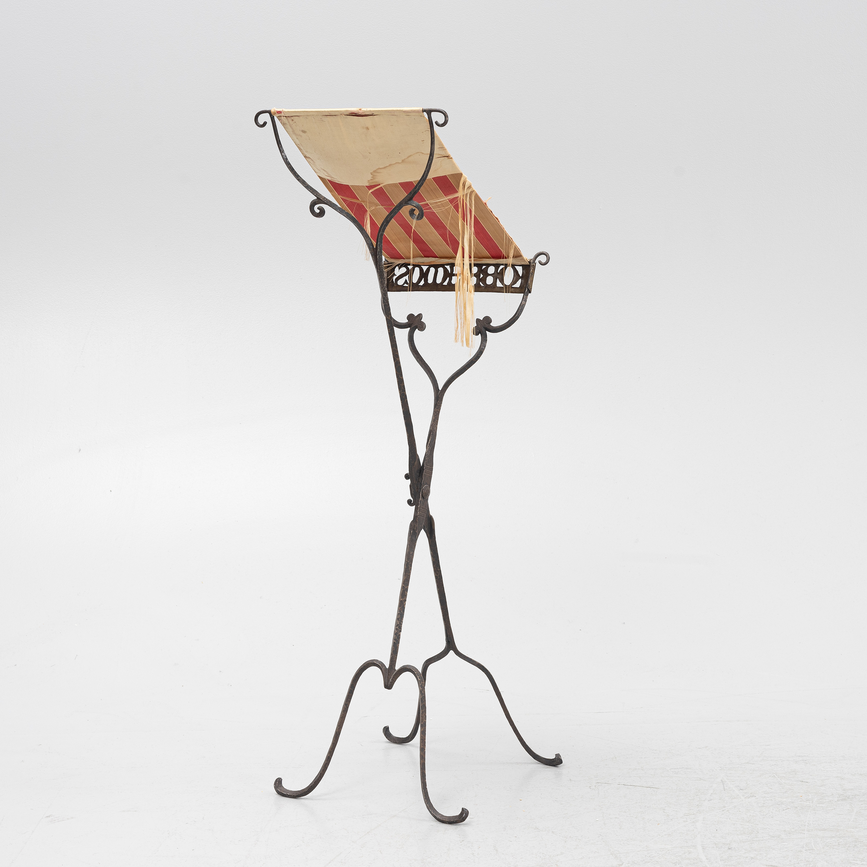 An iron book stand early 20th Century. Bukowskis