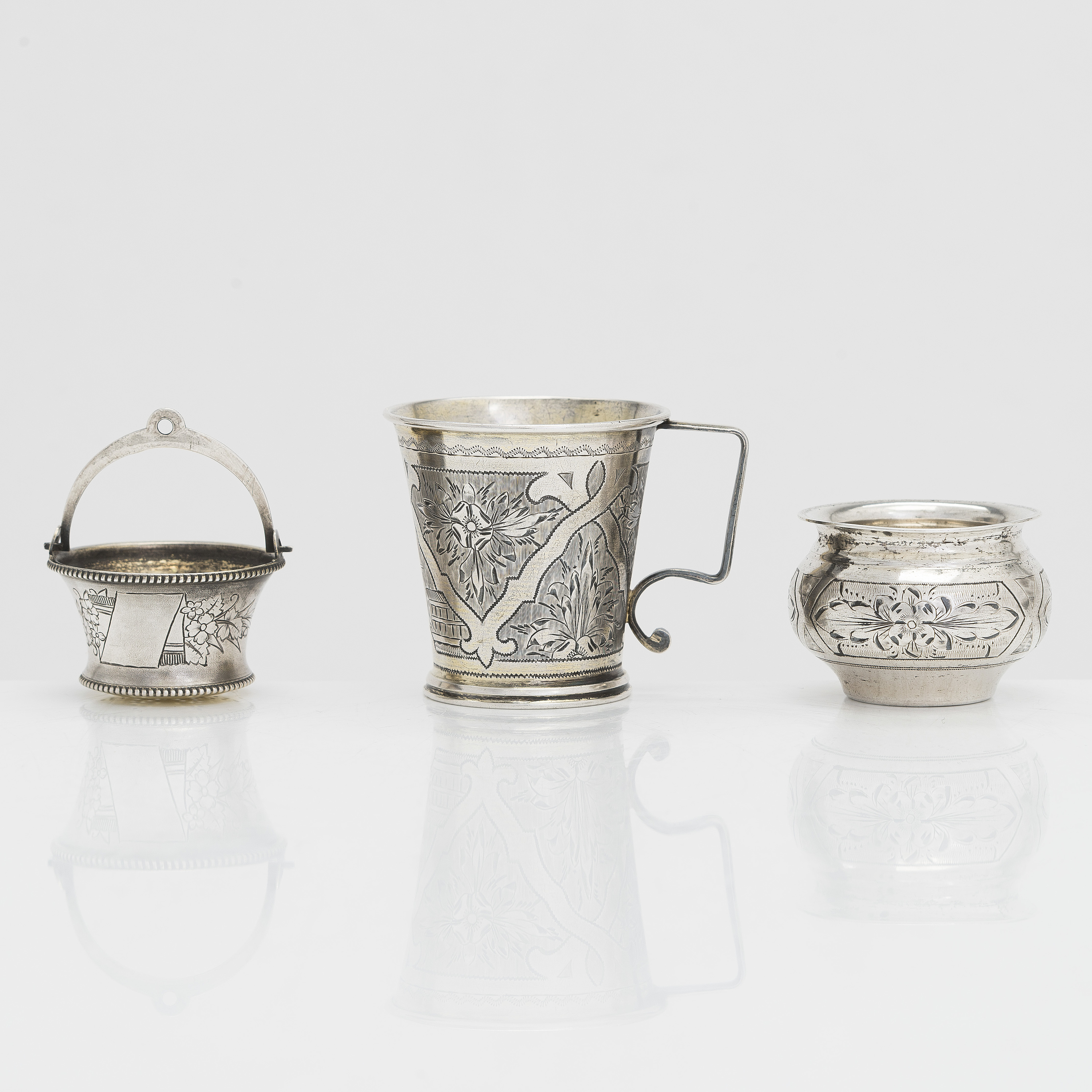A silver beaker, tea strainer, and salt cellar, Moscow 18771888, by