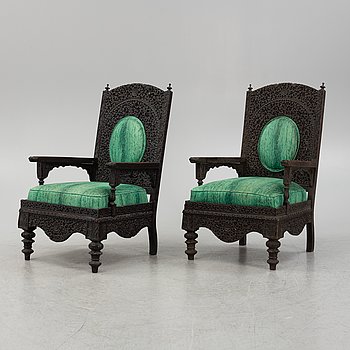 A pair of Angloindian carved chairs, India, 19th century, in so called 'Bombay style'.