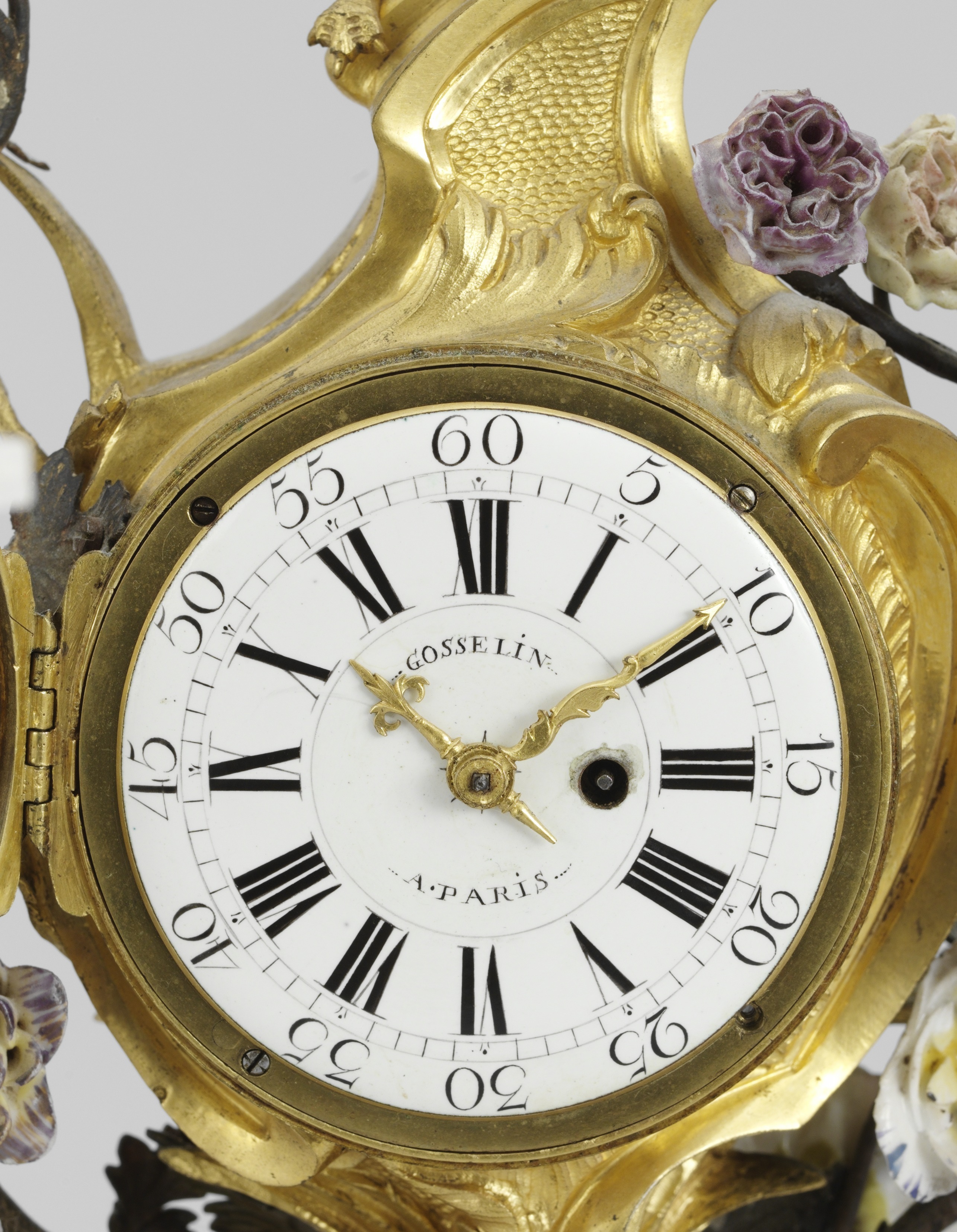 A French Louis XV 18th century table clock. Dial face marked "GOSSELIN A PARIS", clockwork